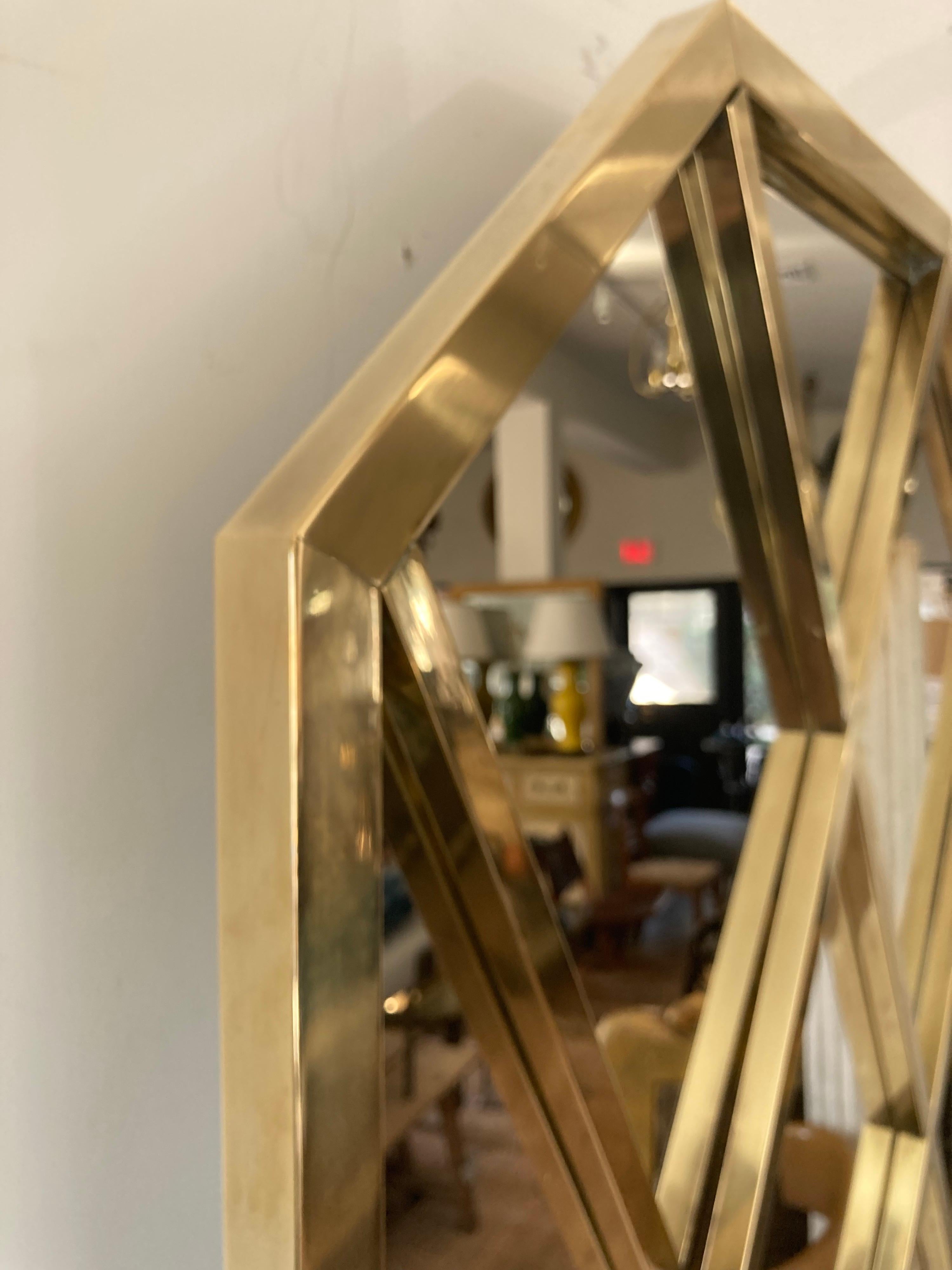 Lattice framed brass mirror. Interesting criss-cross patterned brass frame.