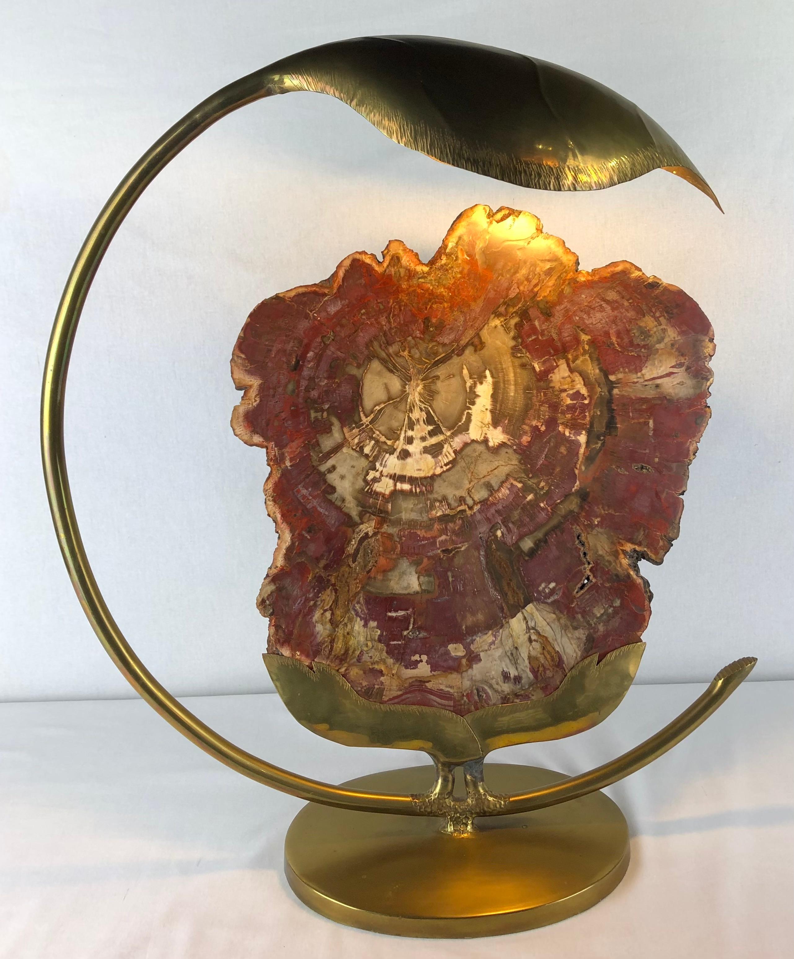 This striking table lamp, designed by renowned French artist Henri Fernandez in the 1970s, will add a touch of sculptural elegance to any room. Crafted from brass and featuring a unique agate quartz or stone element, the lamp creates a captivating