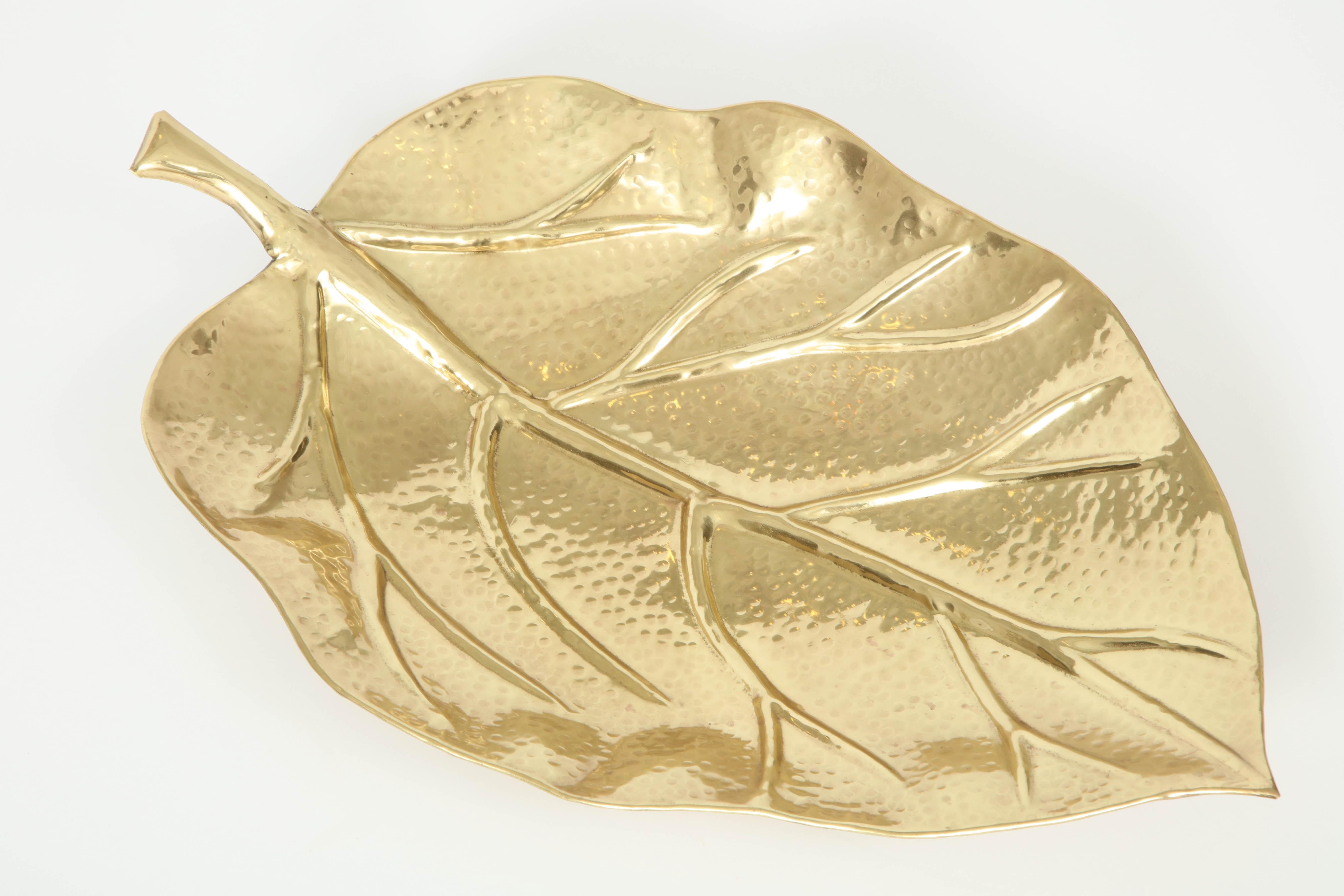 Decorative midcentury brass bowl in the shape of a large leaf, Italy, circa 1950.