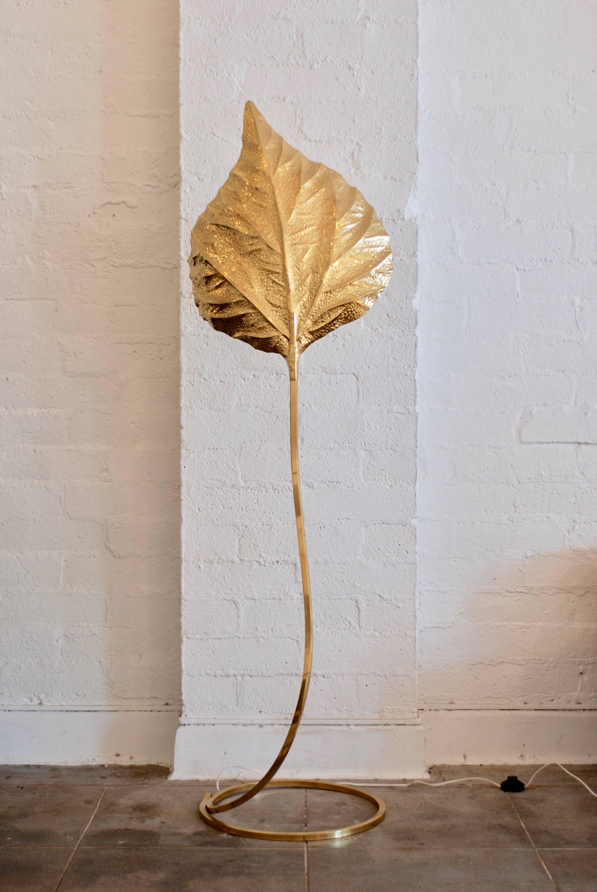 A 1970s era brass leaf floor lamp by the Italian designer Tommaso Barbi. He was known for his quality organic inspired lighting designs. 
The lamp is a rhubarb leaf which is beautifully rendered in brass. The lamp is in excellent condition and the