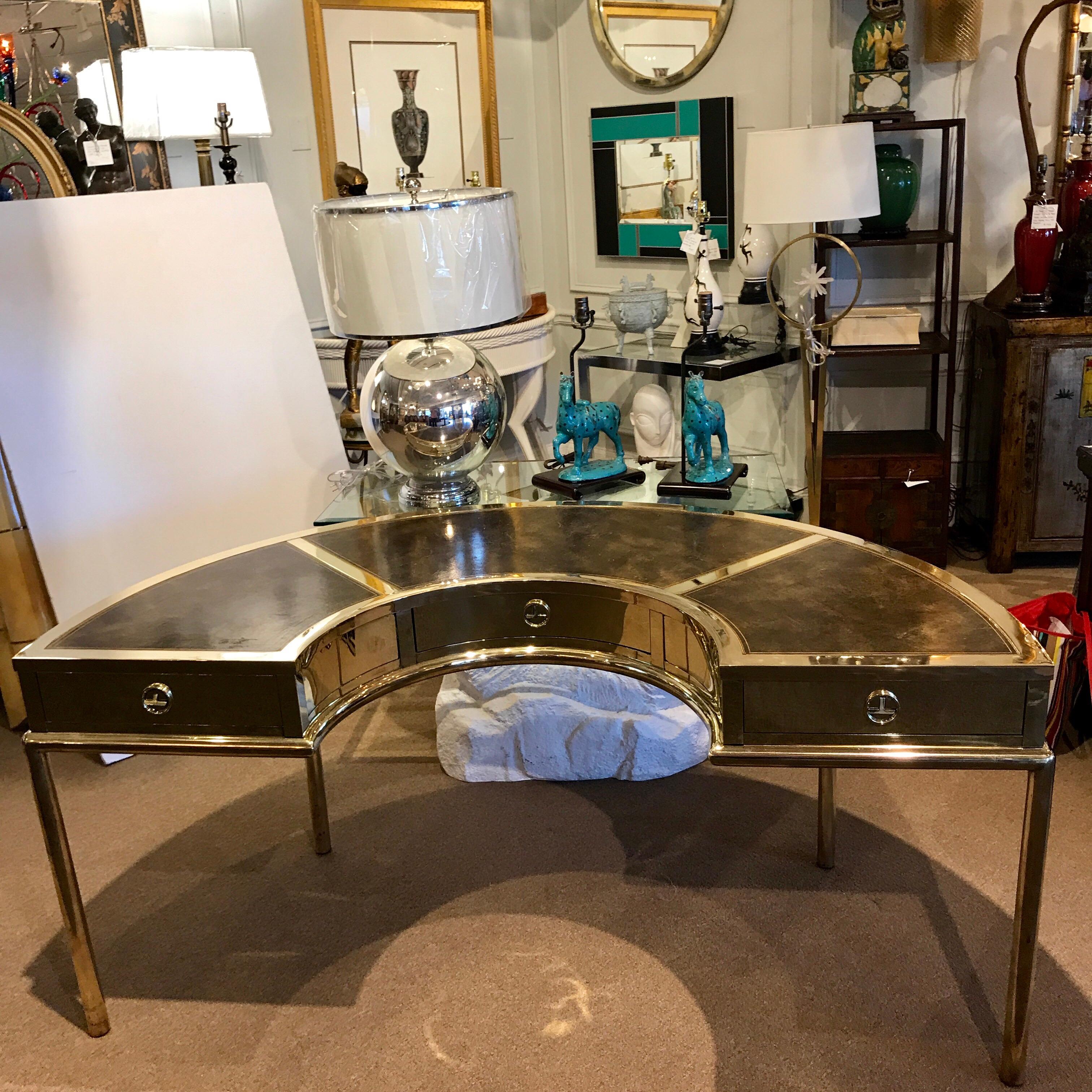 Brass and leather semicircular Mastercraft desk, with three section tooled top, fitted with three drawers
Measures: 19.5