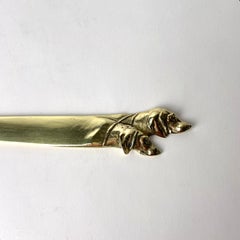 Brass Letter Opener decorated with dog heads from the early 20th Century