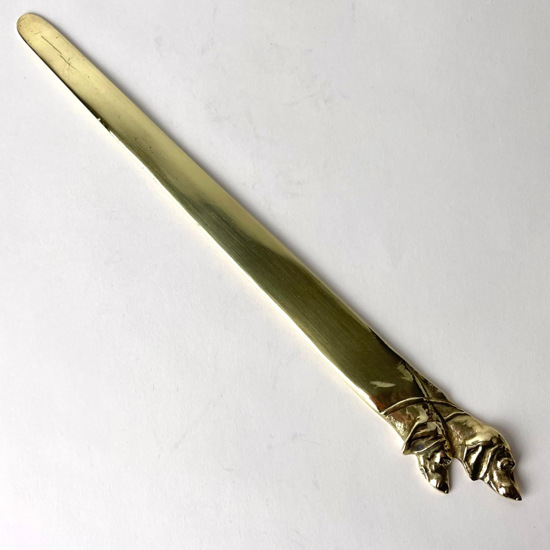 Art Nouveau Brass Letter Opener decorated with dog heads from the early 20th Century For Sale