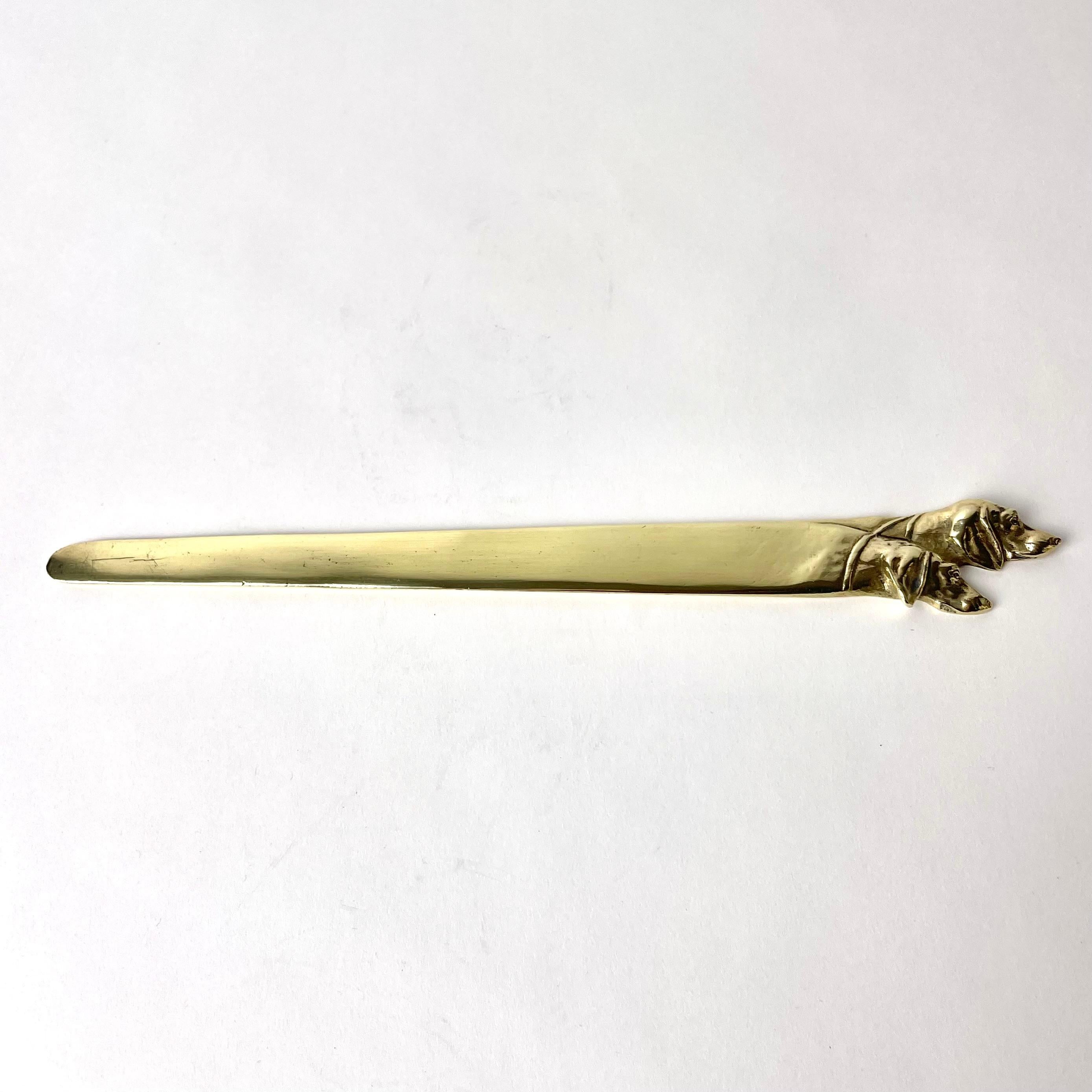 European Brass Letter Opener decorated with dog heads from the early 20th Century For Sale