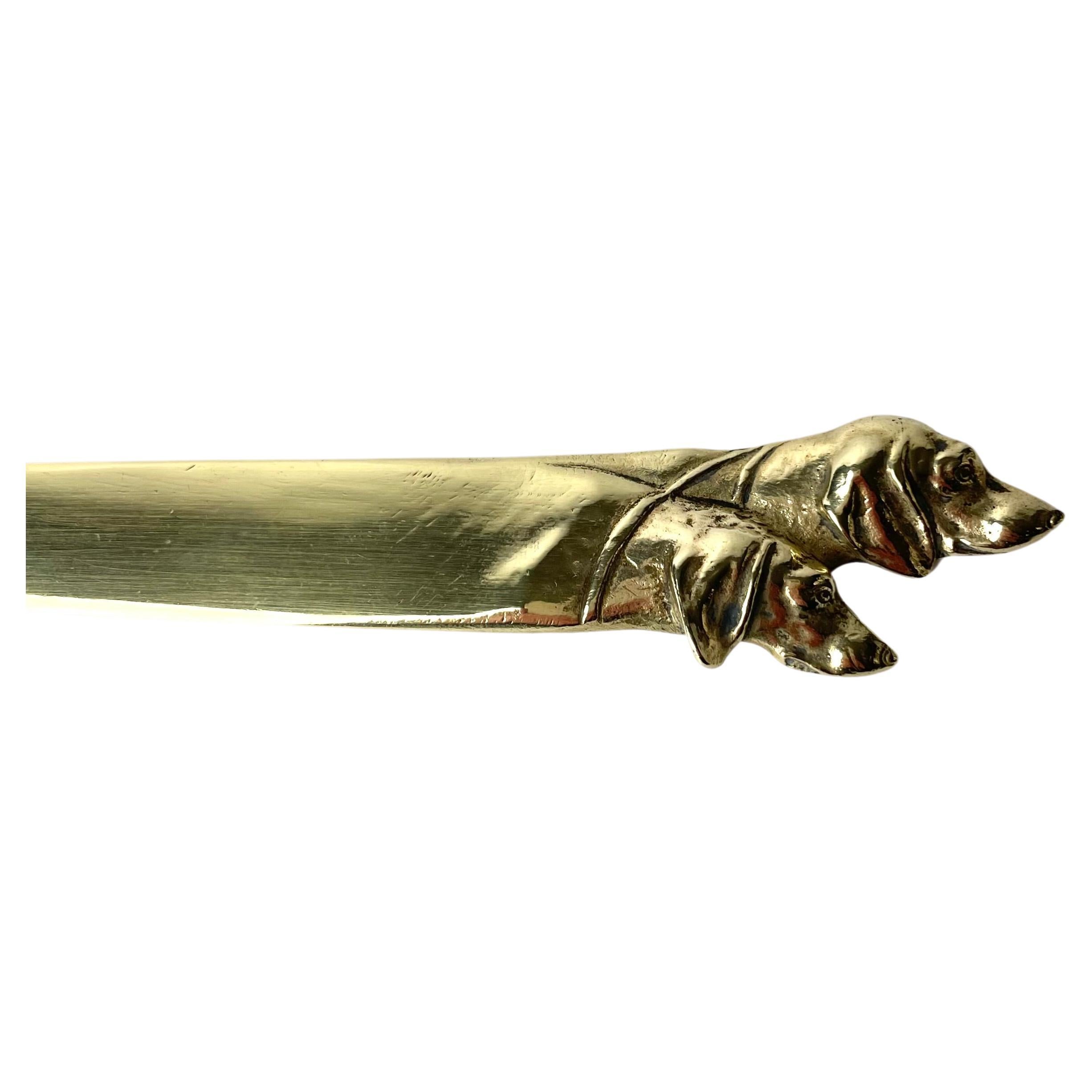 Brass Letter Opener decorated with dog heads from the early 20th Century For Sale