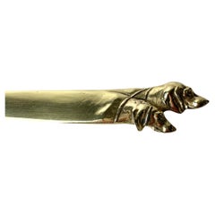 Antique Brass Letter Opener decorated with dog heads from the early 20th Century