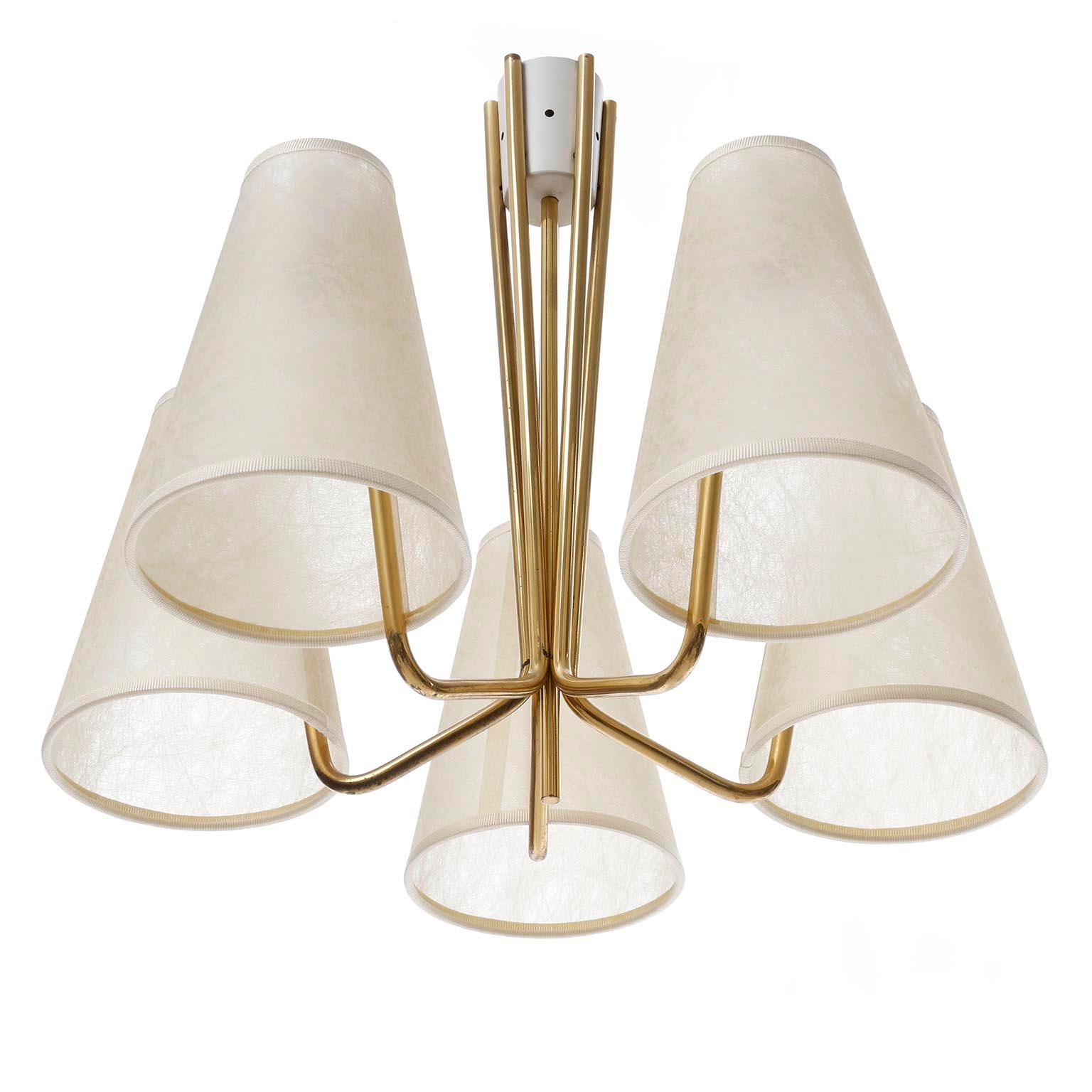 A brass flush mount chandelier model 'ANNABELLE' no. 5181 with five arms and parchment lamp shades by J.T. Kalmar, Vienna, Austria, manufactured in midcentury, ca. 1960 (late 1950s or early 1960s).
The light is documented in the Kalmar catalogue
