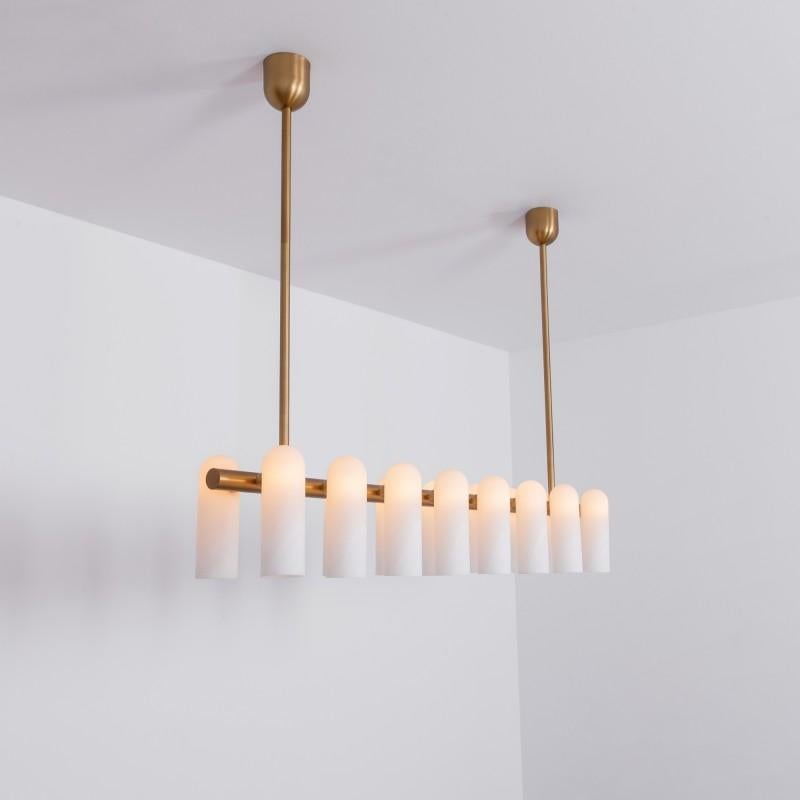 Odyssey Linear LG Brass Chandelier by Schwung
Dimensions: W 182 x D 31 x H 132 cm
Materials: Brass, frosted glass

Finishes available: Black gunmetal, polished nickel, brass
Other sizes available

 Schwung is a german word, and loosely defined,