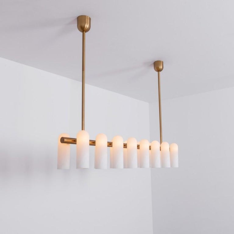 Brass linear chandelier 16 by Schwung
Dimensions: W 182 x D 31 x H 132 cm
Materials: Brass, frosted glass

Finishes available: Black gunmetal, polished nickel, brass
Other sizes available

 Schwung is a german word, and loosely defined, means energy