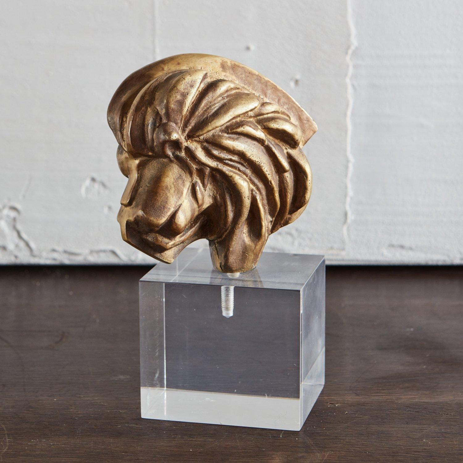 A beautiful brass lion sculpture mounted on a square lucite base. Unsigned. Sourced in Italy, 1970s.
