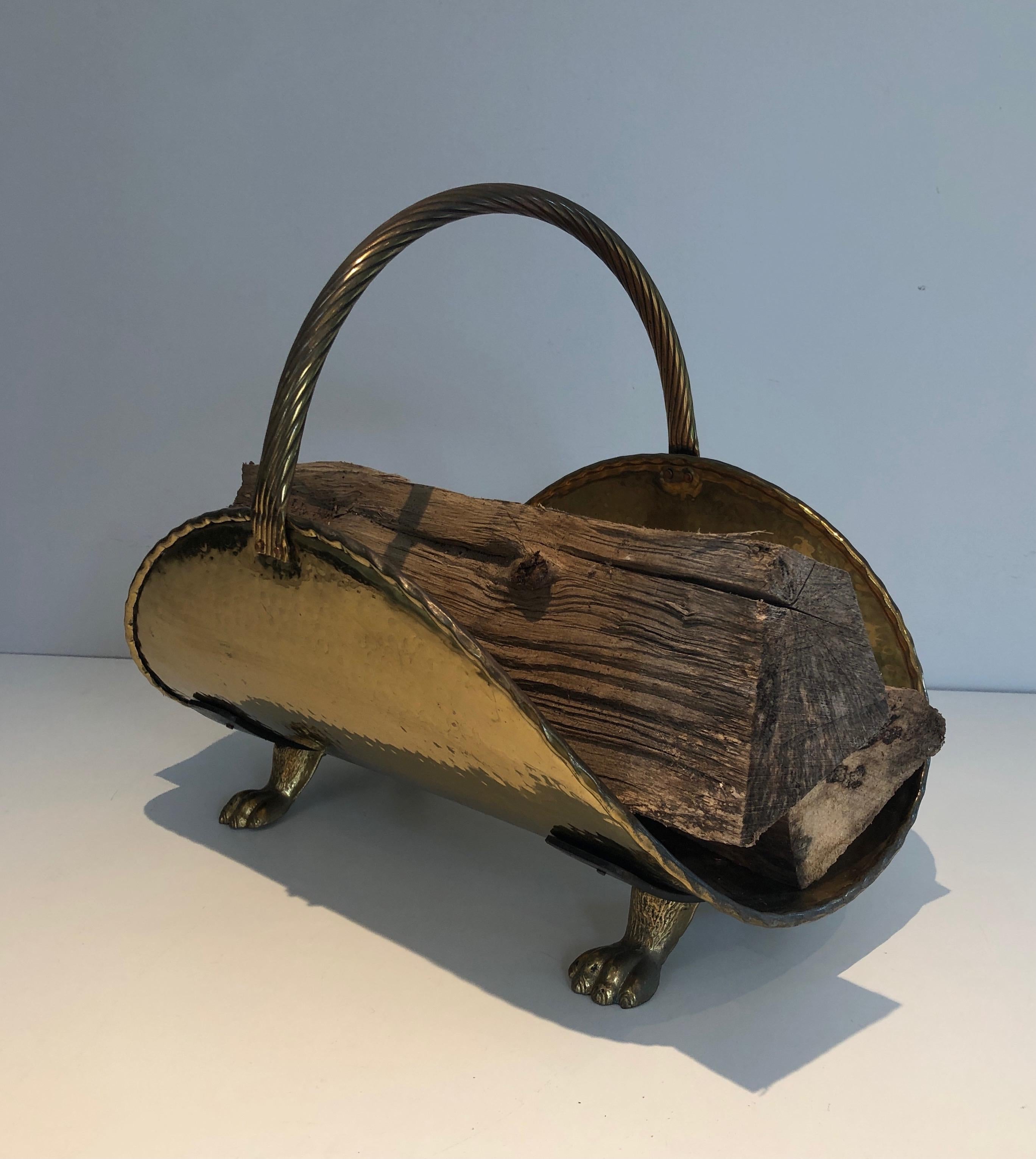 This logs holder is made of brass with claw feet. This is a French work. Circa 1970.