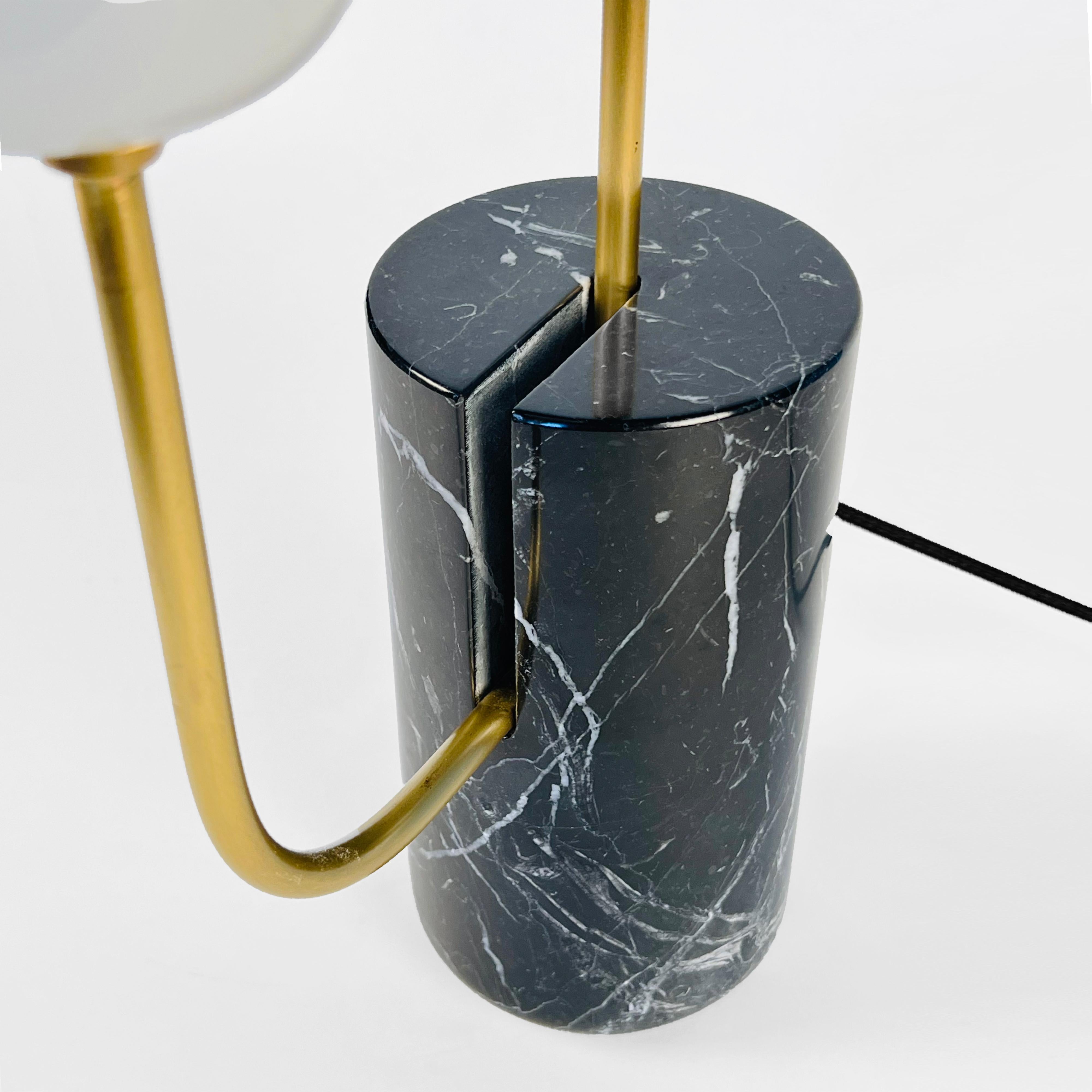 American Brass Loop Table Lamp with Black Marble Base and White Capsule Shade For Sale