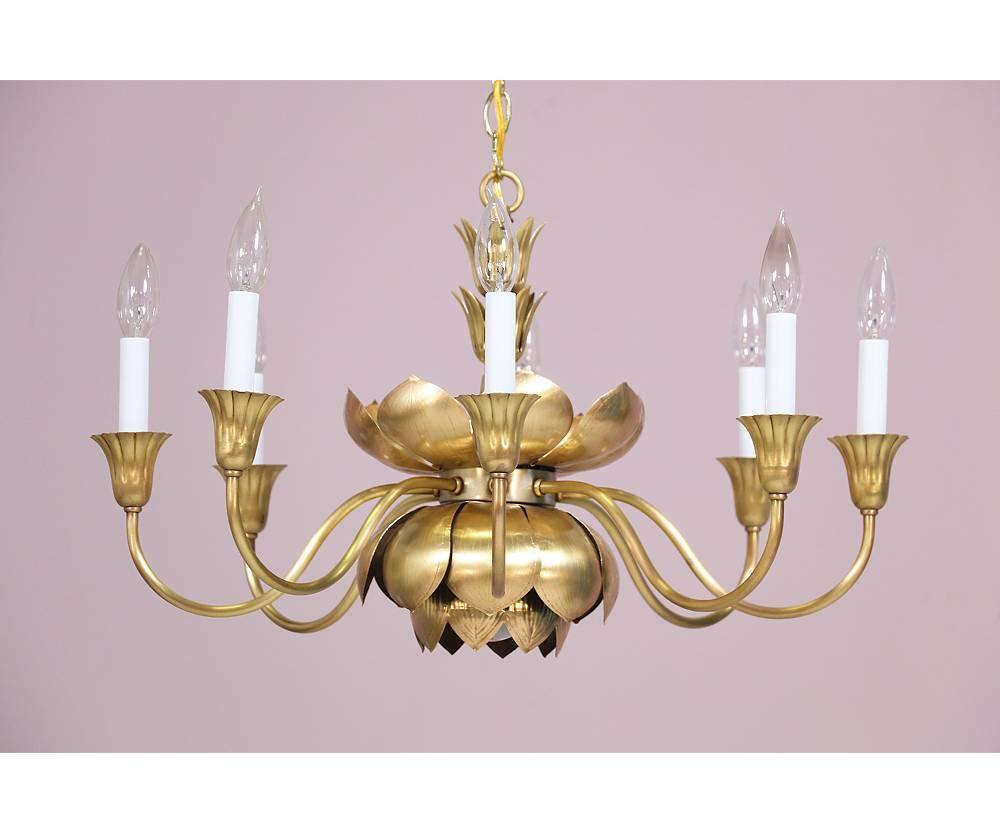 Gorgeous, 1970s brass lotus chandelier  by Feldman Lighting, Los Angeles. The chandelier consists a brass lotus from which 8 arms spring. Wired and in working condition. Requires 8 candelabra bulbs. Ceiling canopy and chain for installation are