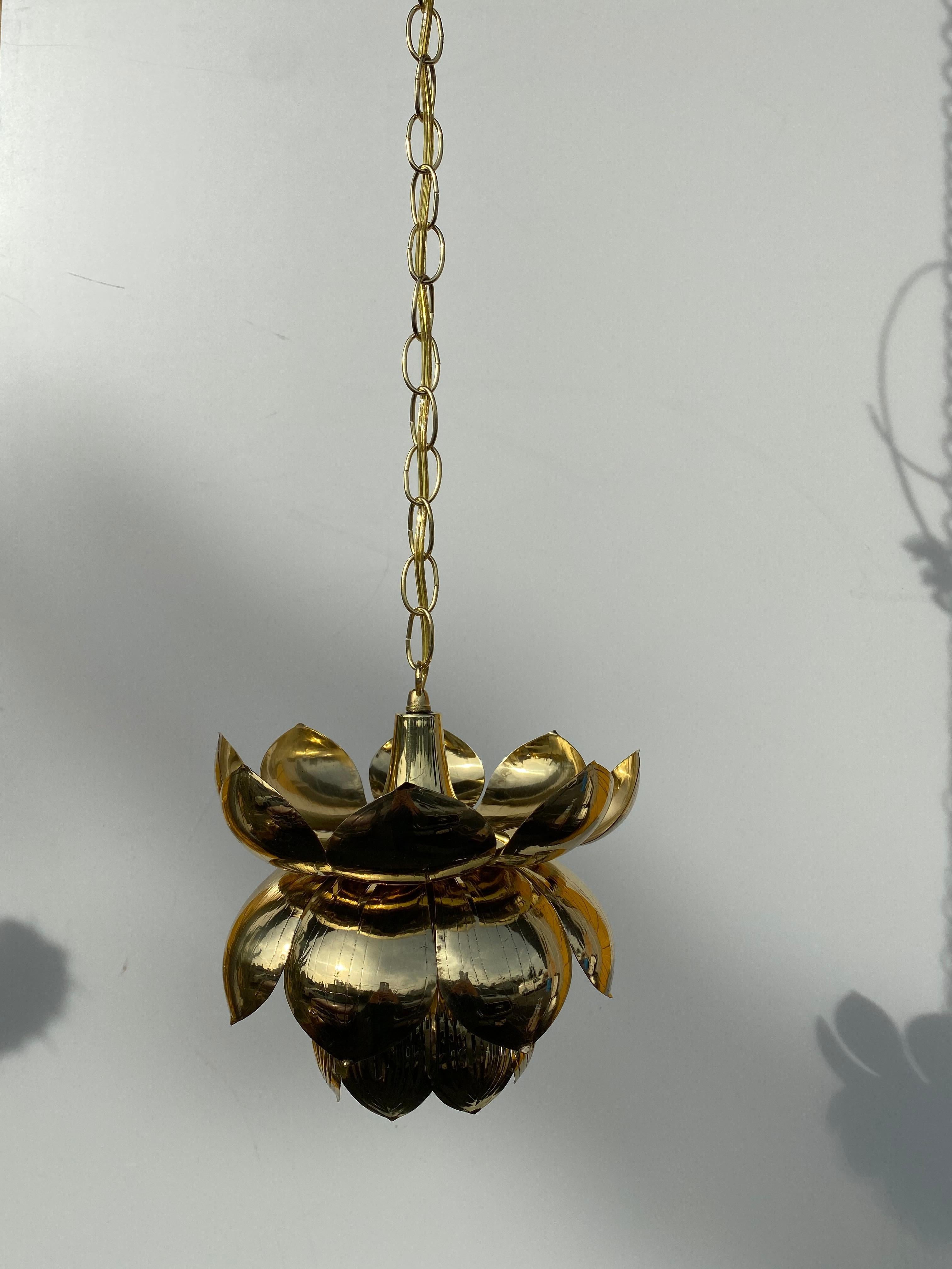 Brass lotus pendant attributed to Feldman. Requires one up to 60watt regular bulb. Comes with 40
