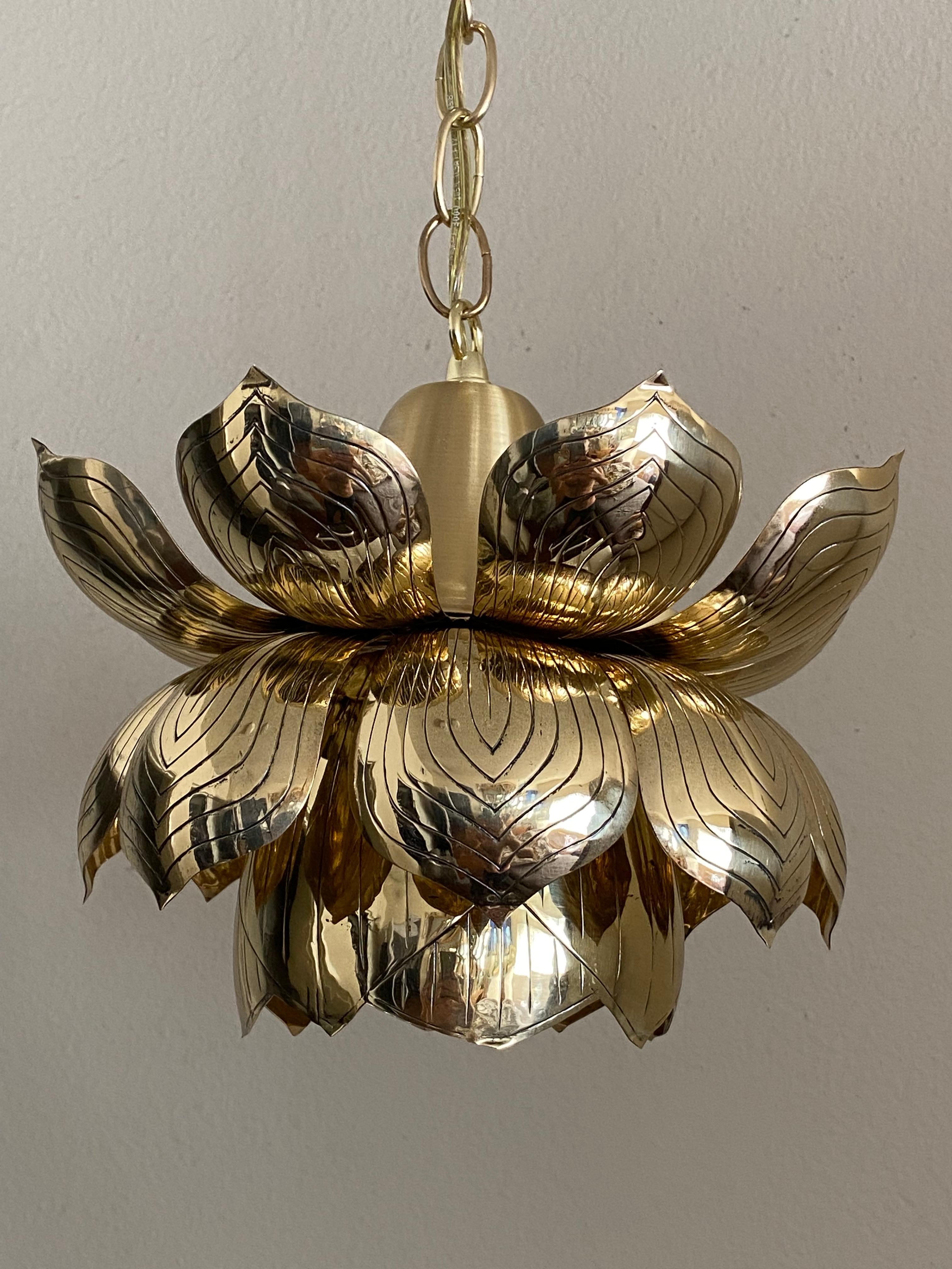 Polished brass lotus pendent light attributed to Feldman. Overall height is 48