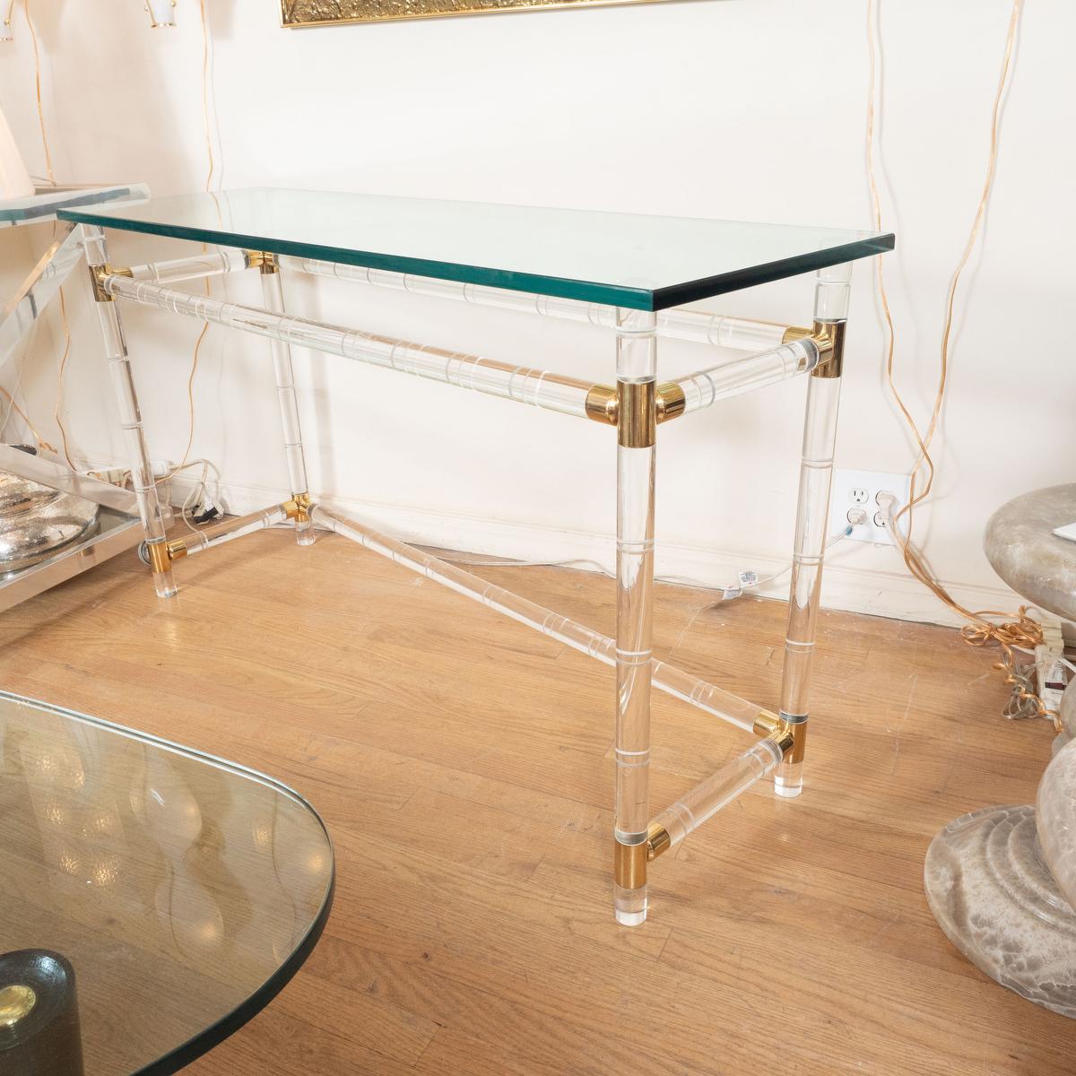 Brass lucite and glass slender console attributed to Charles Hollis Jones.