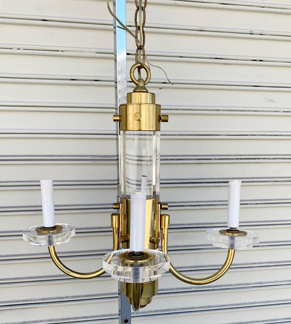 Beautiful brass and Lucite chandelier in the style/attributed to Charles Hollis Jones.
The chandelier has 4 arms with a 3