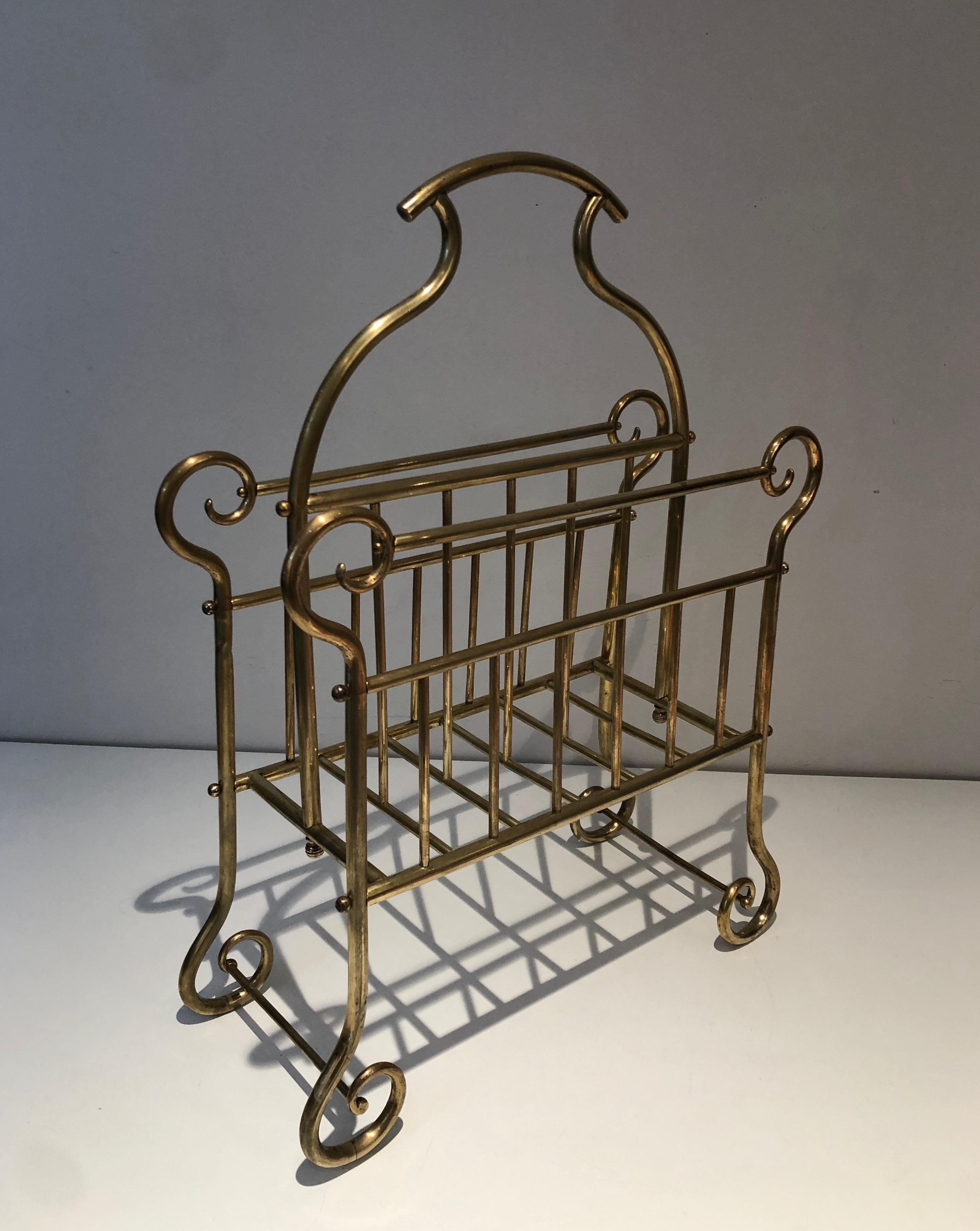 This magazine rack is made of brass. This is a French work, circa 1900.