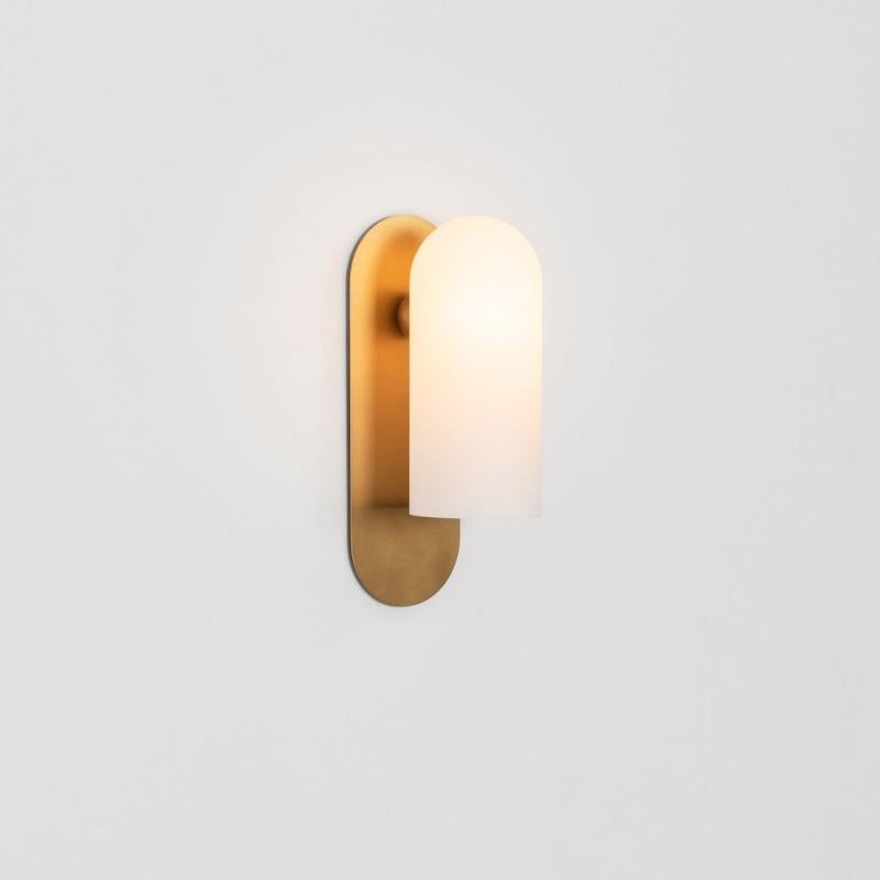 Odyssey MD Brass Wall Sconce by Schwung
Dimensions: W 10.5 x D 14 x H 30.5 cm
Materials: Brass, frosted glass

Finishes available: Black gunmetal, polished nickel, brass
Other sizes available

 Schwung is a german word, and loosely defined, means