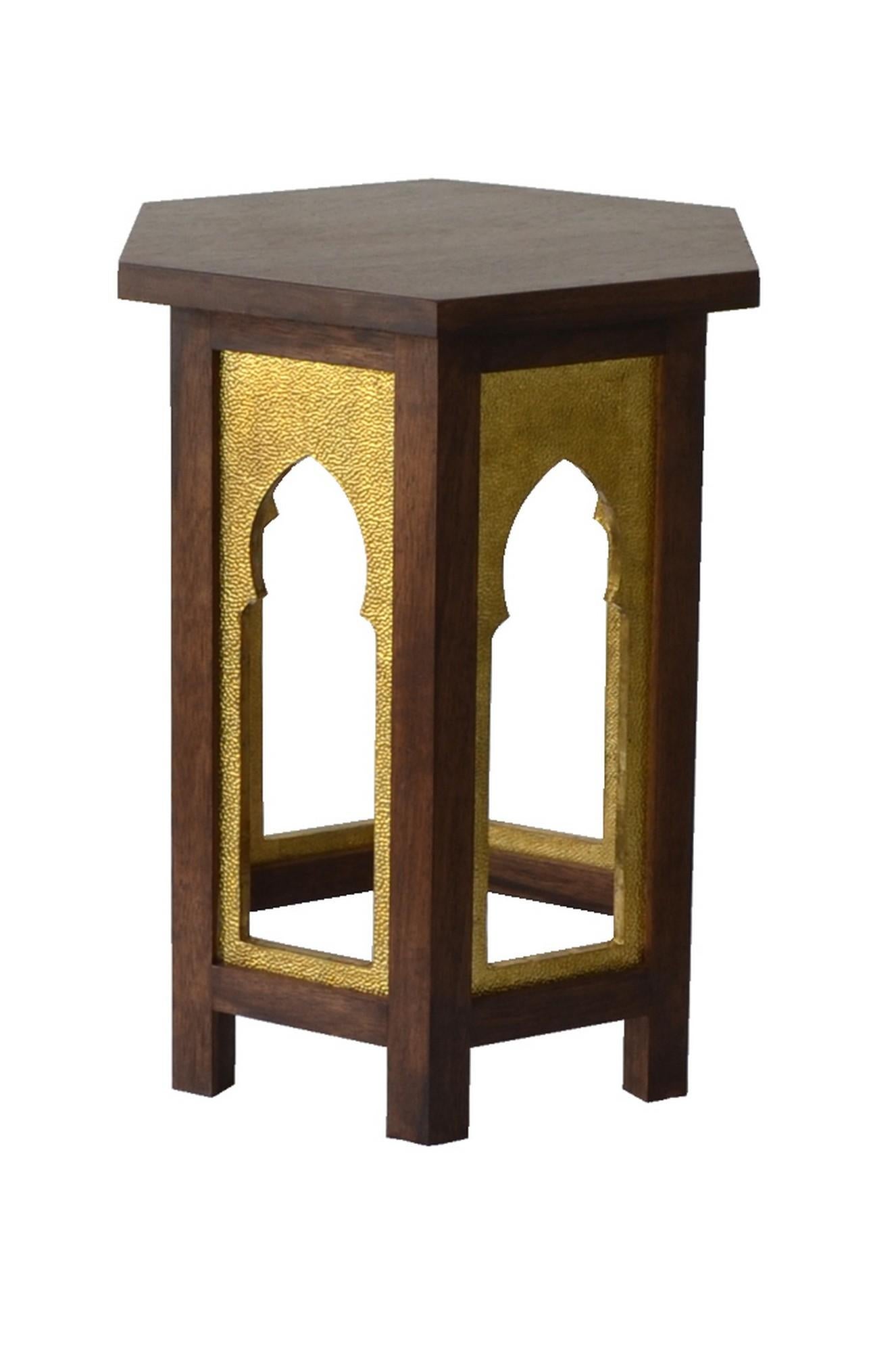 Inspired by the Mehraab element of Indian architecture, this simple design from Stephane Odegard's Udaipur Atelier, uses hammered brass clad mehraab on a hexagonal Mango wood table.
 
Mehraab Table Brass 
Size- 16
