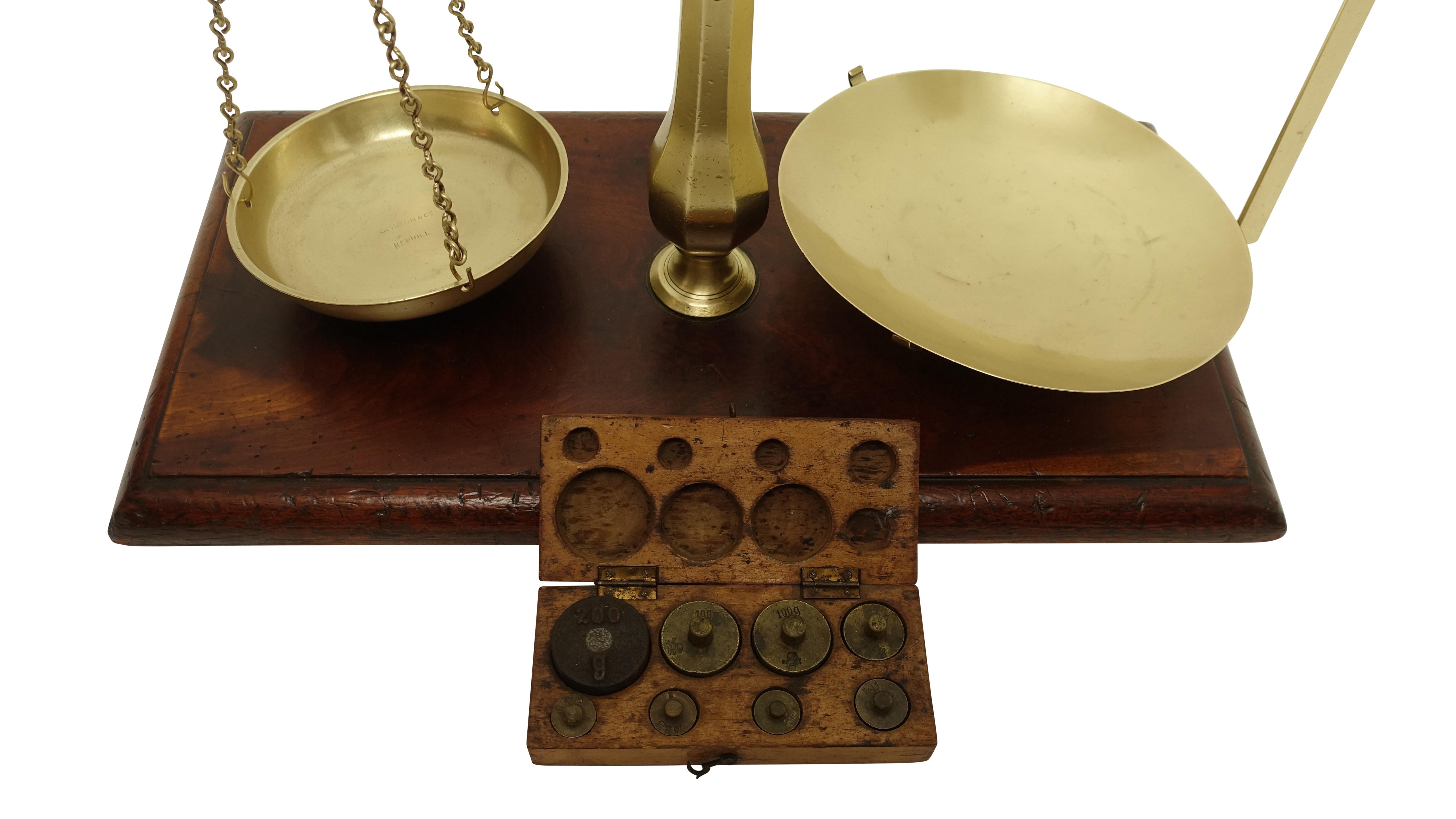 Brass merchants scale on a mahogany base with a full set of boxed weights, England, circa 1870.



   