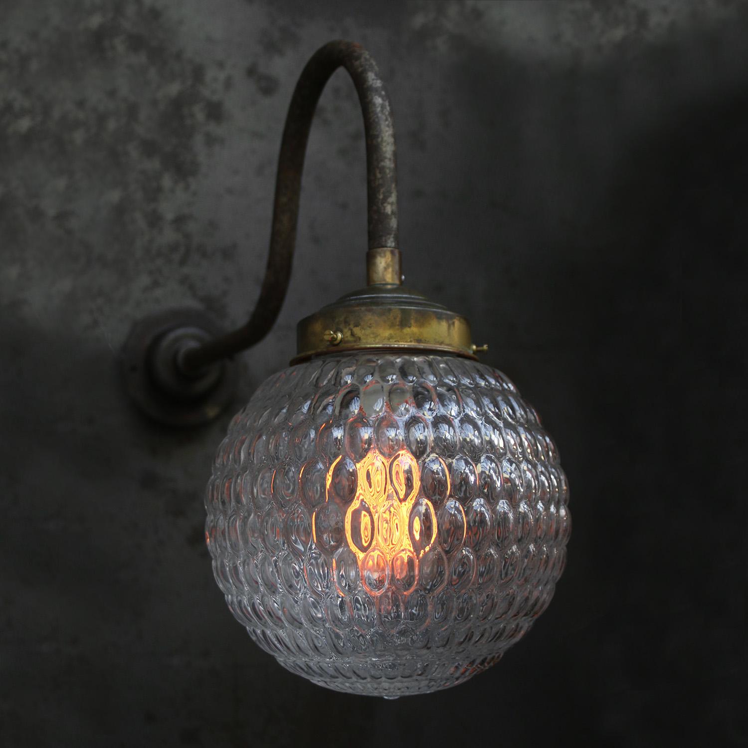 Brass and cast Iron Industrial wall light
clear bubble glass globe

Diameter cast iron wall piece: 10.5 cm / 4”, 2 holes to secure

Weight: 3.20 kg / 7.1 lb

Priced per individual item. All lamps have been made suitable by international standards