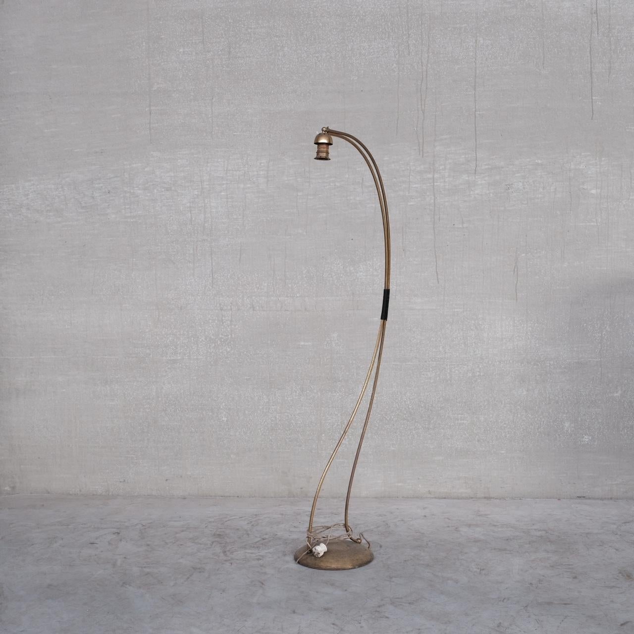 A stylish curved mid 20th brass floor lamp. 

France, c1960s. 

Good patina, the form is particularly attractive. 

Lacking a shade.

Since re-wired and PAT tested. 

Location: Belgium Gallery. 

Dimensions: 145 H x 25 W x 40 D in cm.