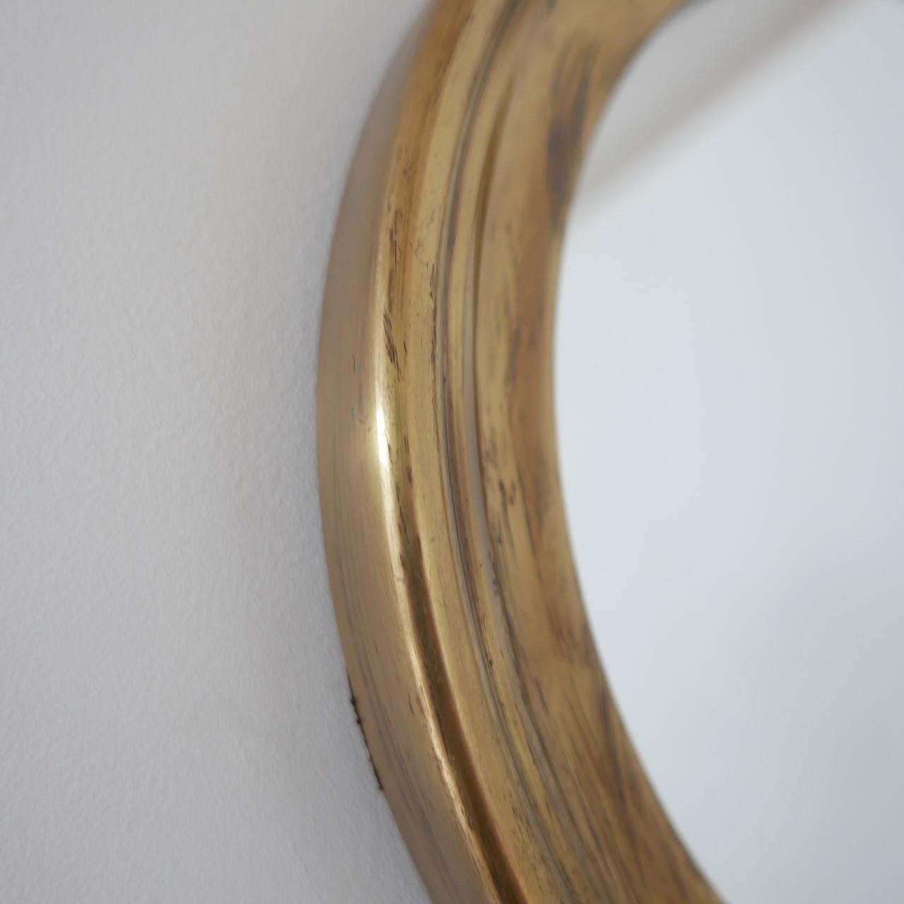 A stylish mid-century Italian stop watch style circular mirror. 

Velvet tie adds character and class. 

Italy, c1970s. 

Good condition, natural patina, some scuffs and wear commensurate with age. 

Dimensions: 30.5 W x 50 H x 2.5 D in cm.