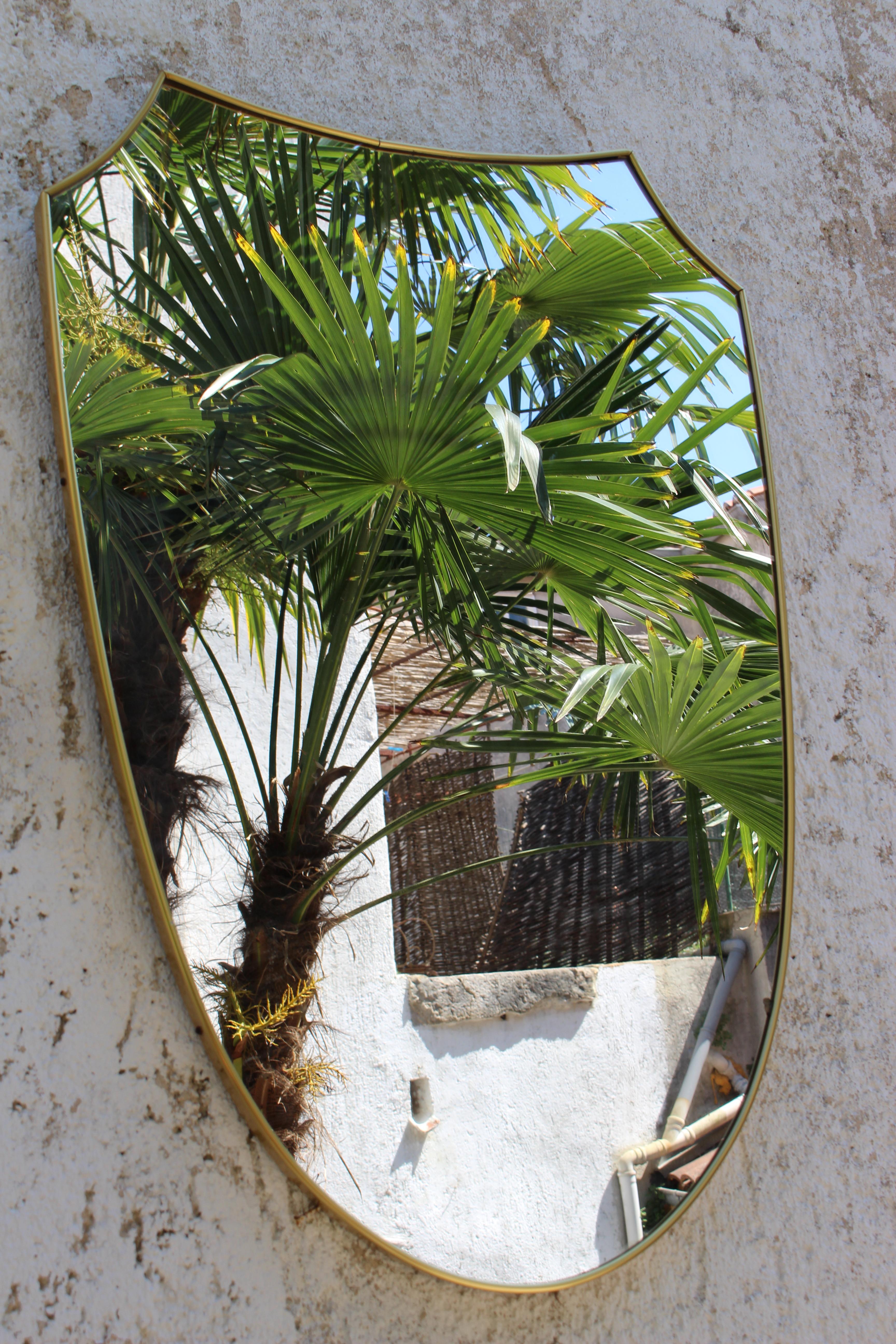 Italian brass wall mirror, period 1950s.
  