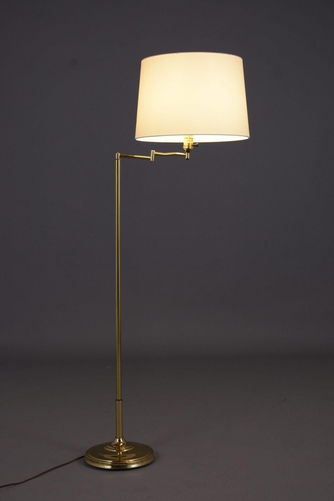Illuminate your space with the timeless charm of our vintage mid-century modern brass floor lamp, a classic piece from the 1970s that has been carefully restored to its former glory by our skilled craftsmen. This lamp combines functionality with