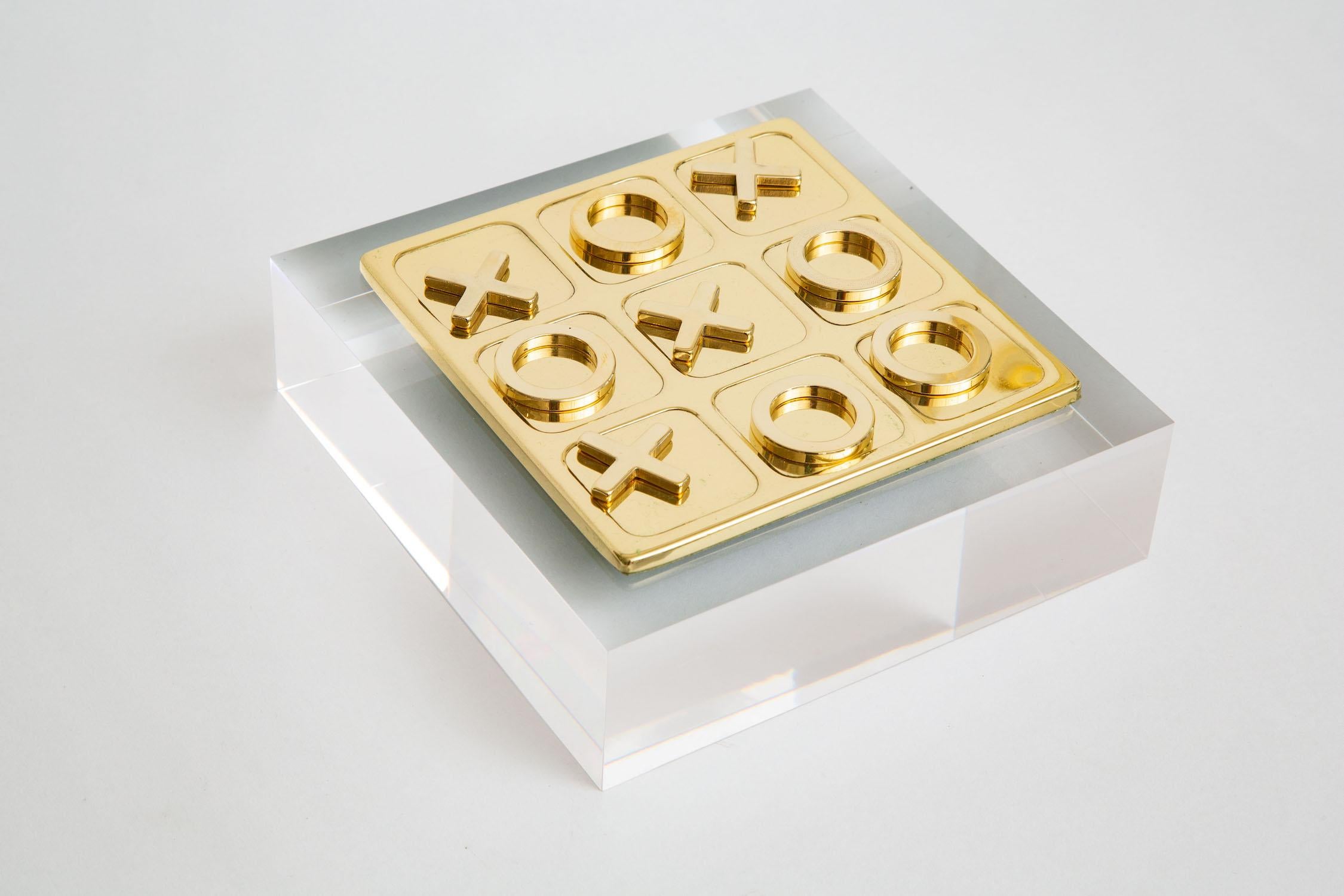 This polished brass Mid-Century Modern vintage tac tac toe square game set has 10 players total of X's and 0