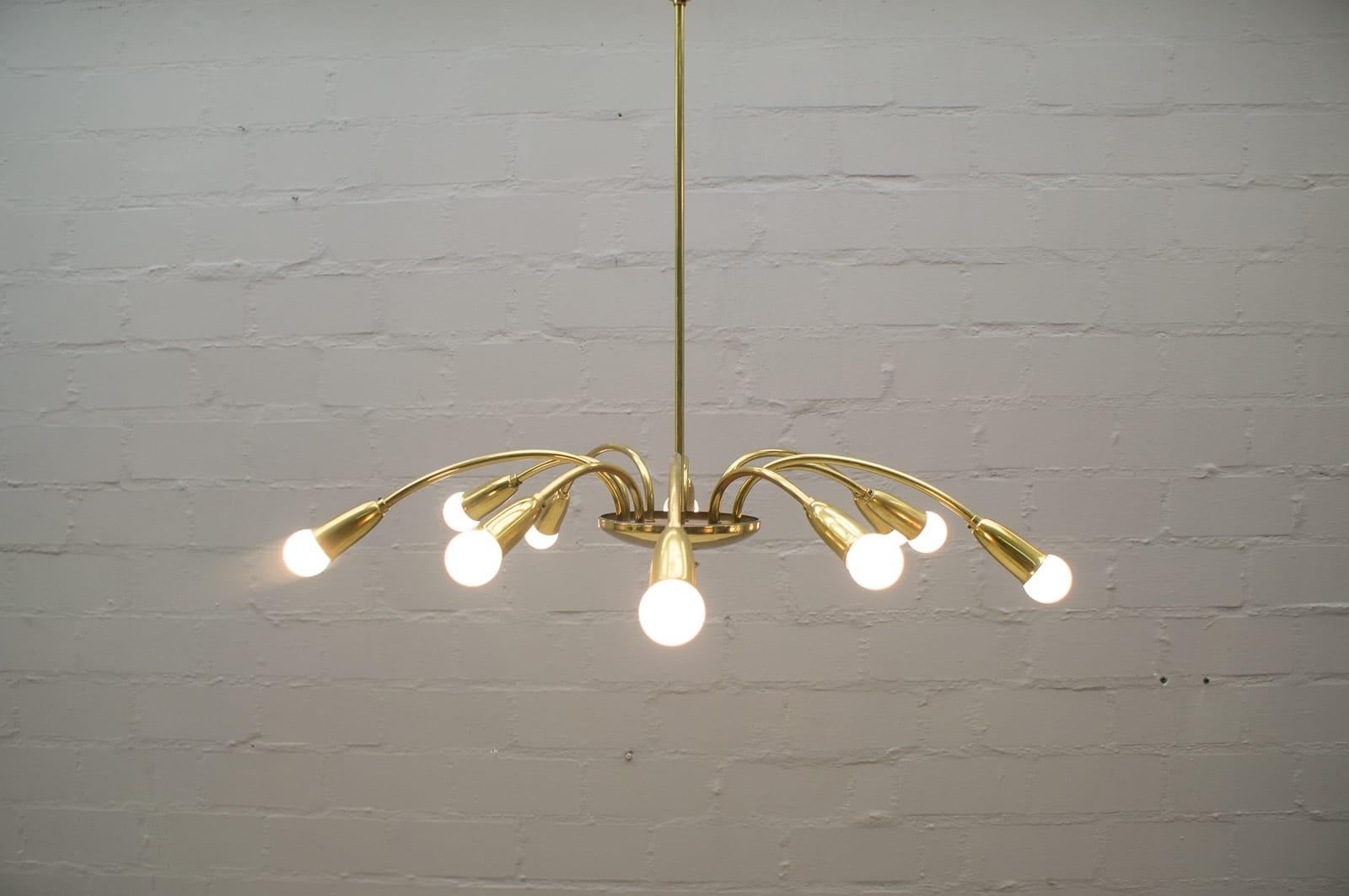 This Sputnik pendant lamp features ten arms in golden brass and requires ten Edison bulbs.

    