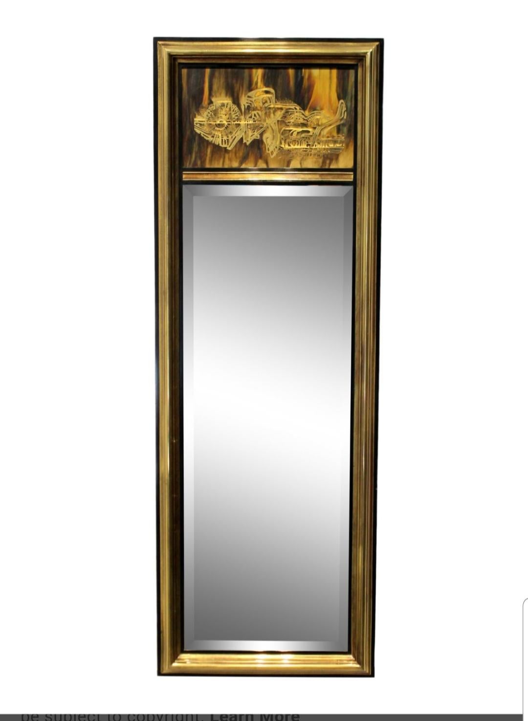 Beautiful brass mirror by Mastercraft. Upper panel designed and created by Bernhard Rohne.
American circa 1970.