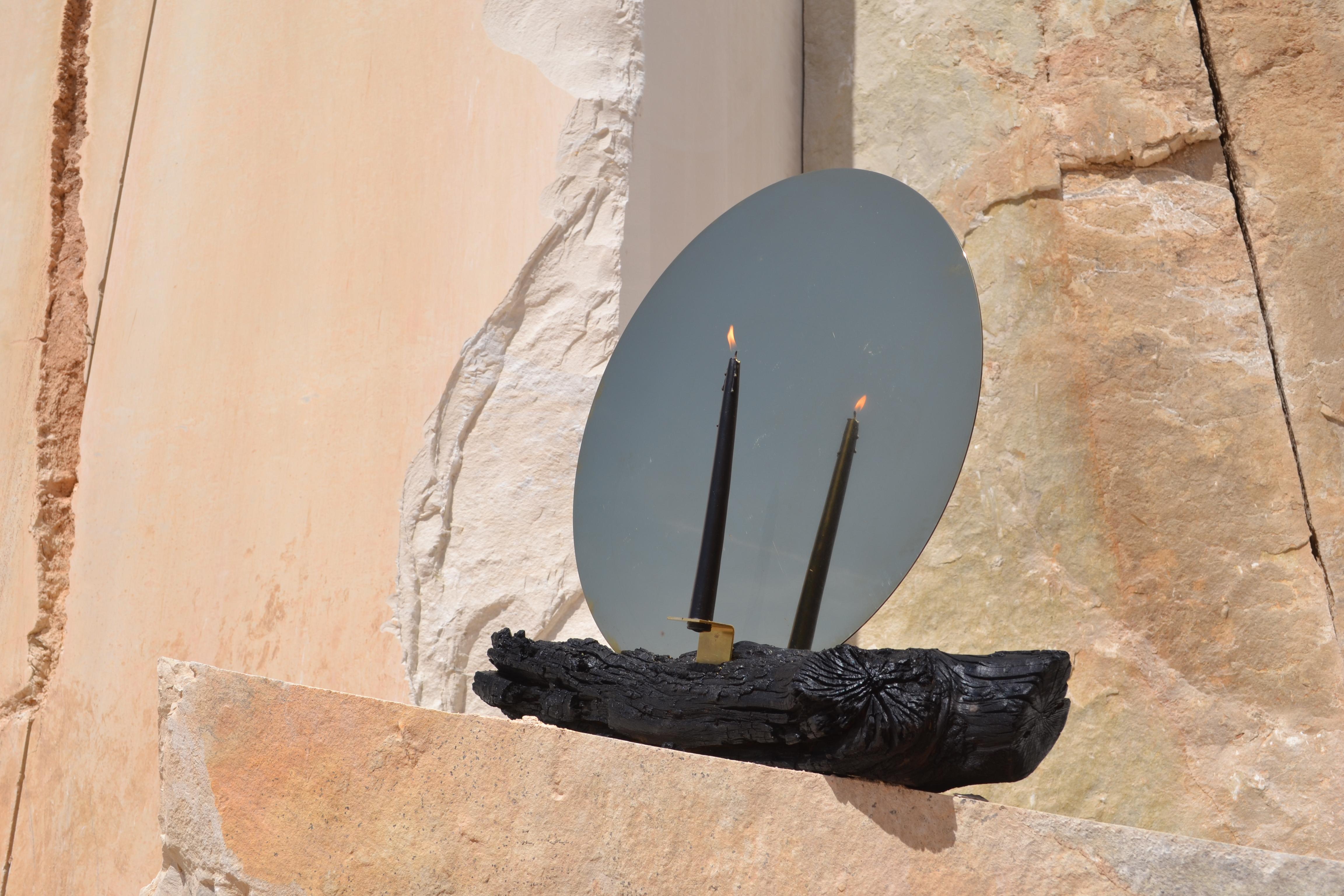 Brass mirror candle holder by Dessislava Madanska
Onedesignspace
Title: Fire for Contemplation
Object: Mirror, Candle Holder
Year: 2021
Materials: burned wood and mirror polished brass
Size: 14 x 62 x 56 cm
Limited Edition of 12+2 A.P.

Dessislava