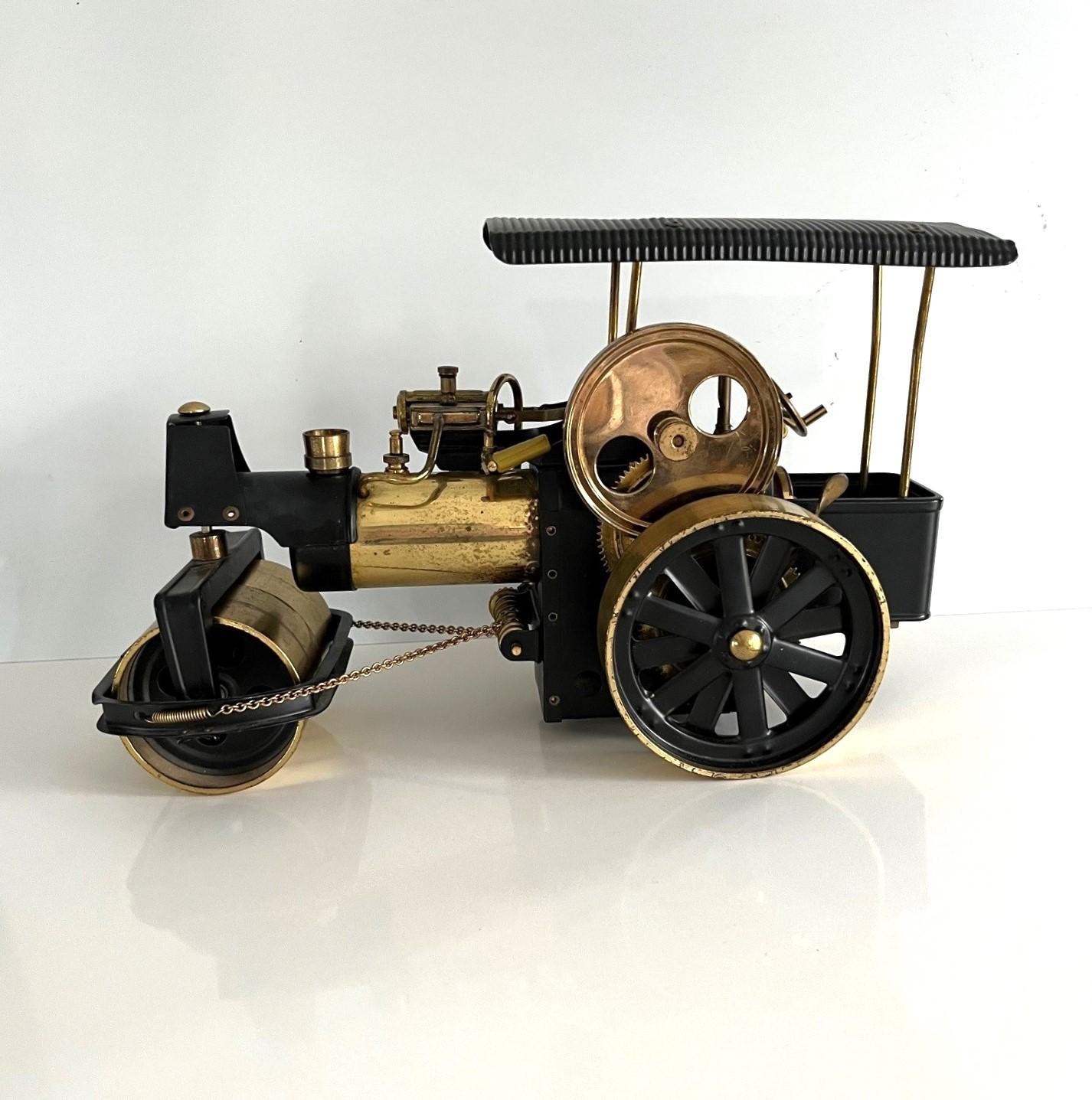 A lovely  Vintage Brass Steam Engine Model.  The piece has good scale and in very good condition, a perfect decorative art piece or shelf model.

Made is West Germany, the item dates to circa 1970s when these where popular as working toys, with