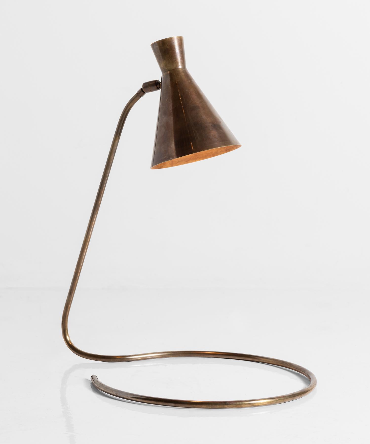 Brass Modern Table Lamp, Italy, 21st Century

Beautifully patinated adjustable shade sits atop a slender arm, which coils into a circular base.