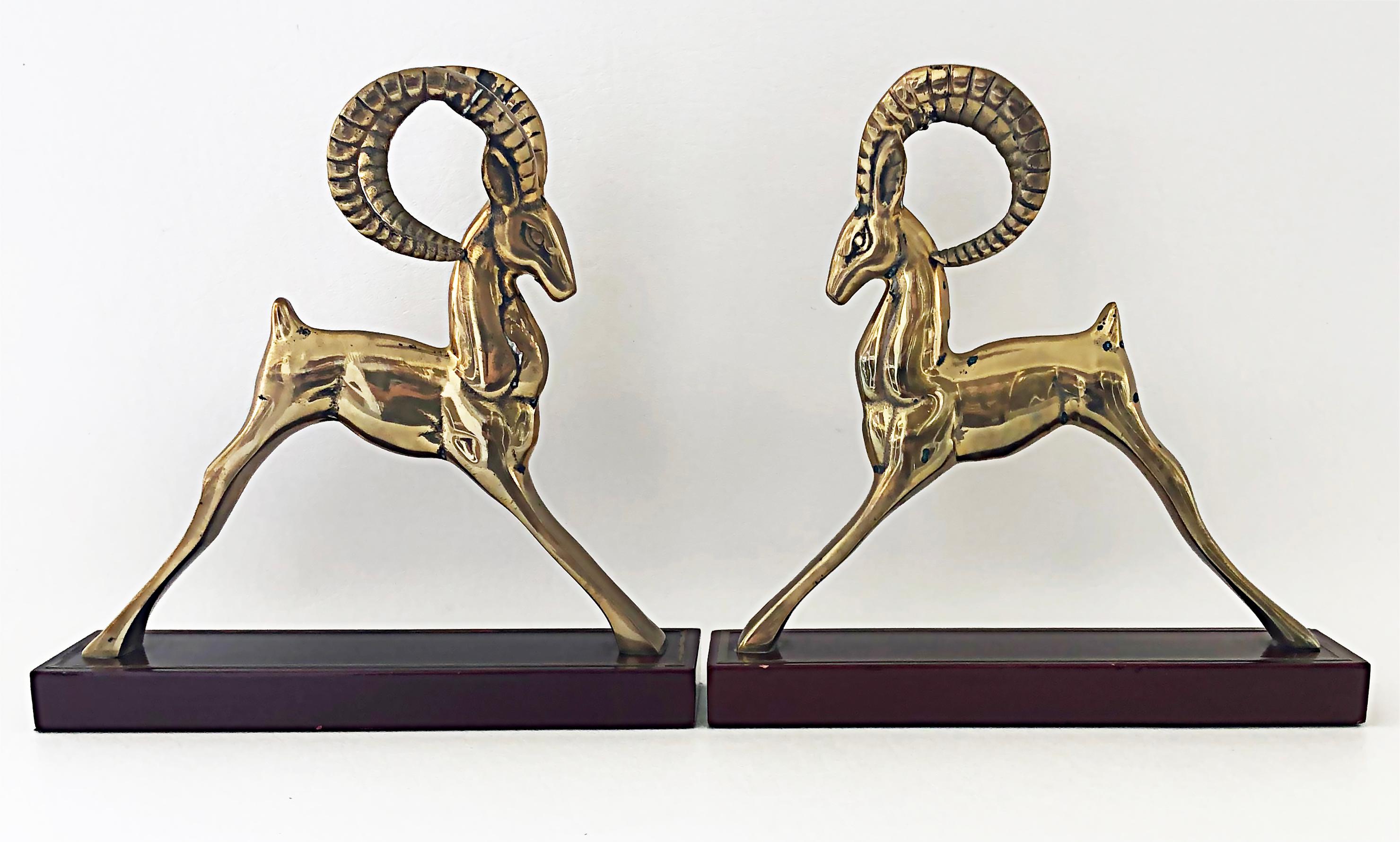 Brass Modernist Deco Style Gazelle bookends sculptures, a pair

Offered for sale is a pair of brass gazelle art deco or modernist style bookends or garniture sculptures. They are mounted on black wood bases with felt beneath. They will look great