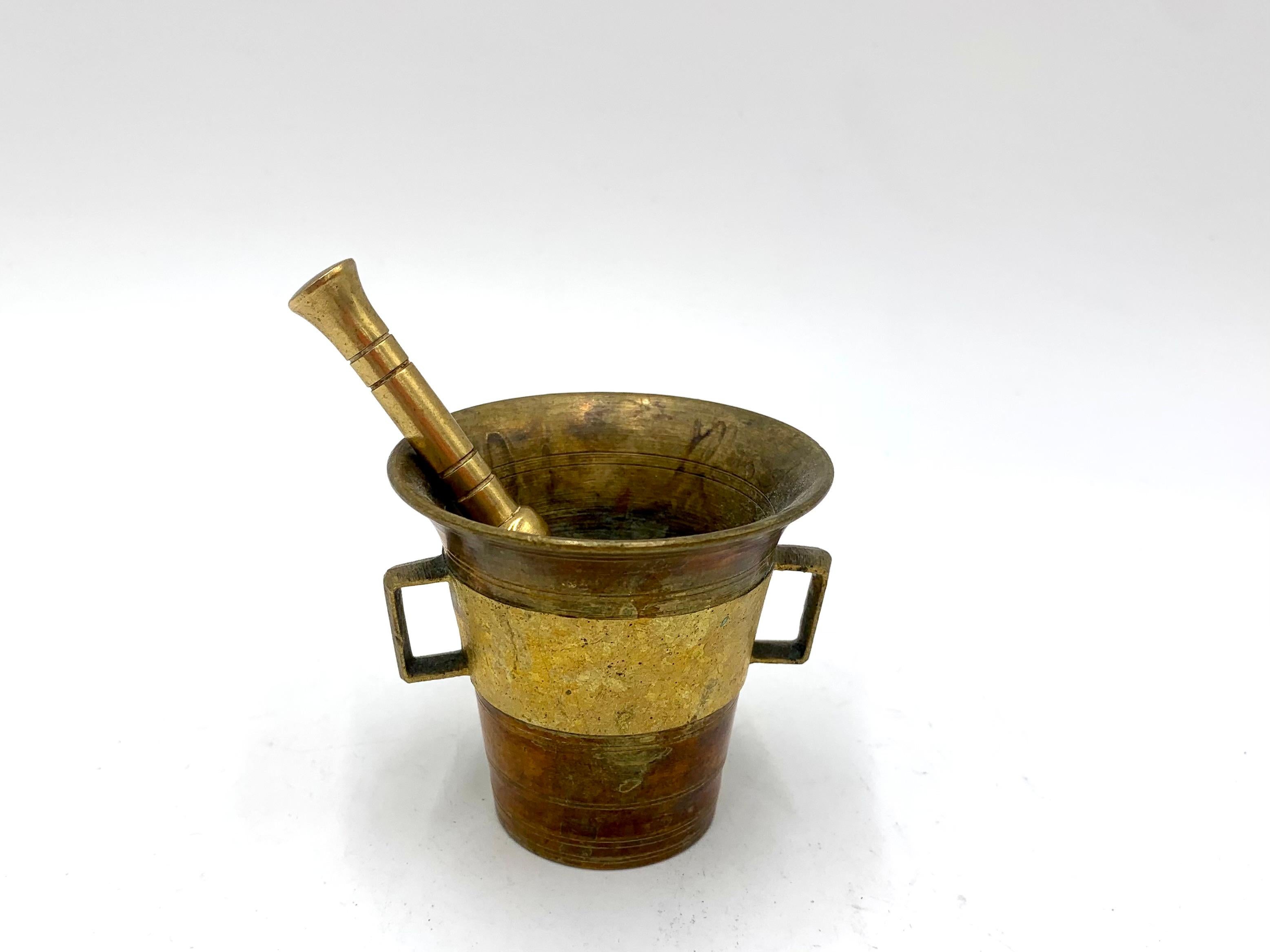 Brass mortar and pestle
height 6 cm, diameter 6.5 cm
very good condition.
 