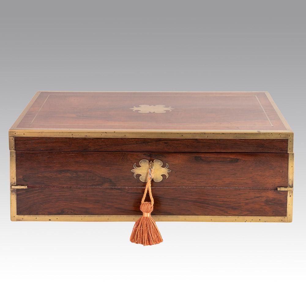 Heading : Brass mounted mahogany writing slope by Nicholas Middleton

Date : c1825

Period : George IV

Origin : London

Decoration : Triple folding mahogany exterior with brass mounting. Interior with velvet lined slope and backboard. Pen tray,