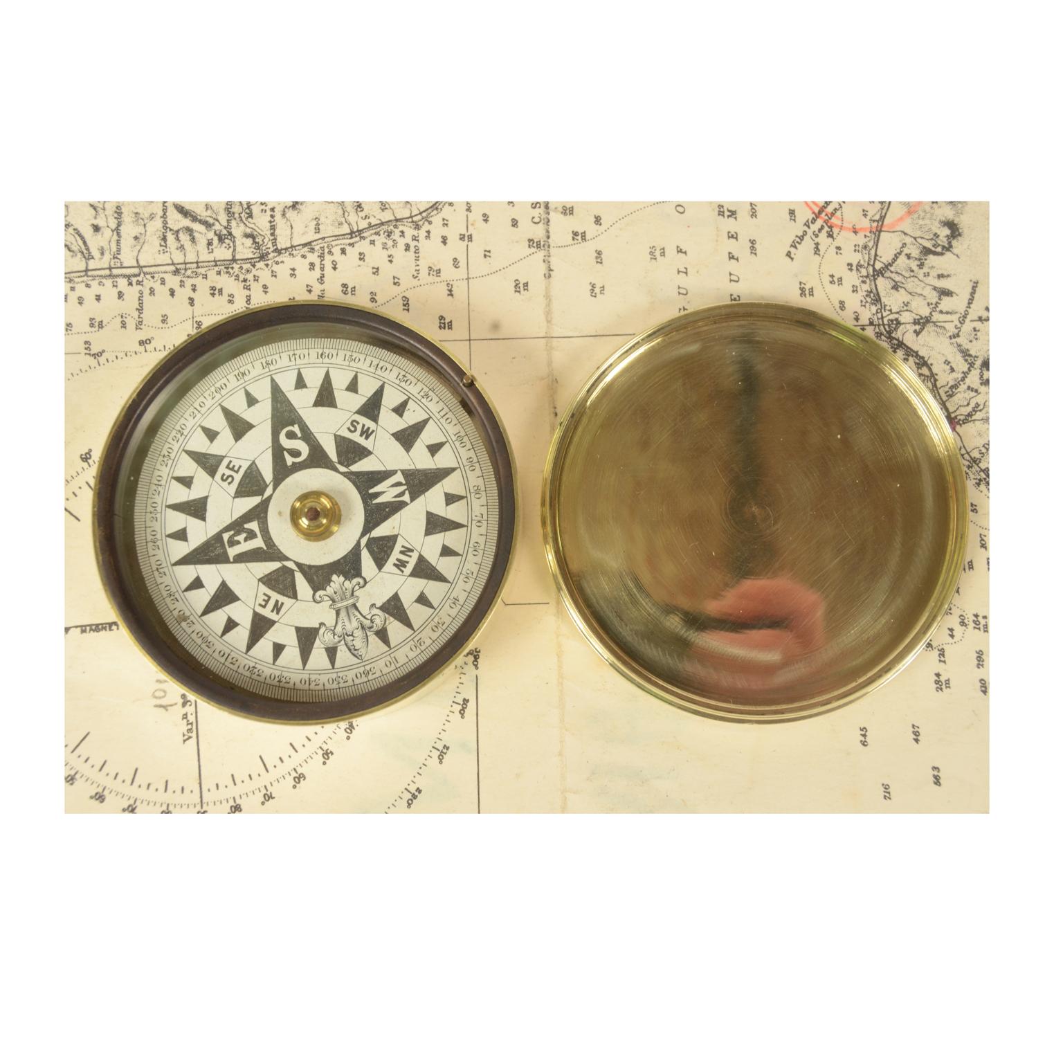 Small nautical pocket compass in its original turned brass case complete with compass card block. On the side an engraving has the name of the owner F. B. Spicer and the name of Filey, an English town in North Yorkshire. English manufacture second