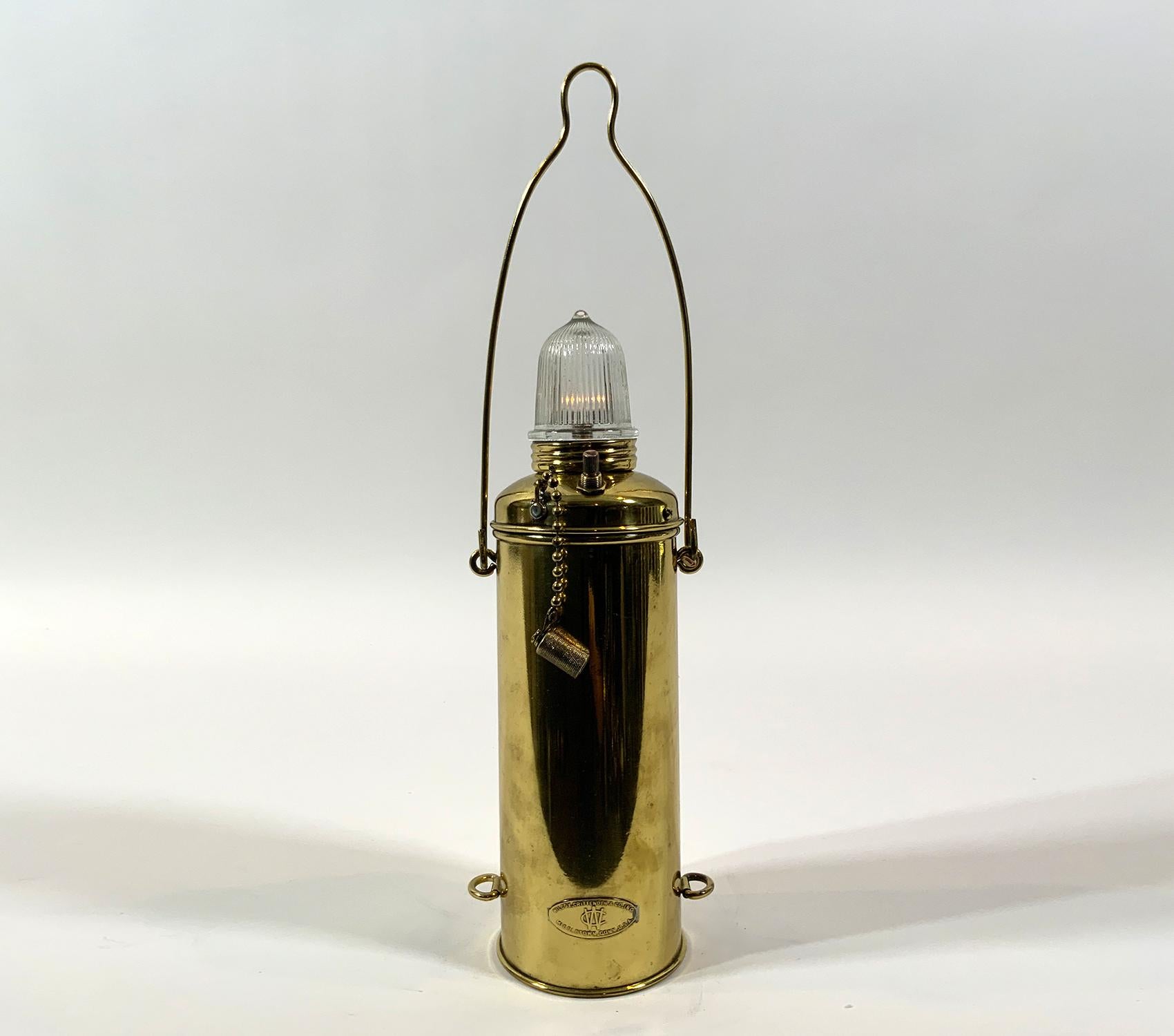 Solid brass marine safety lantern by Wilcox Crittenden of Middletown Connecticut. fine highly polished marine distress lantern with prismatic glass lens and carry handle. With brass makers badge.

Weight: 1 LBS
Overall Dimensions: 12” H x 4