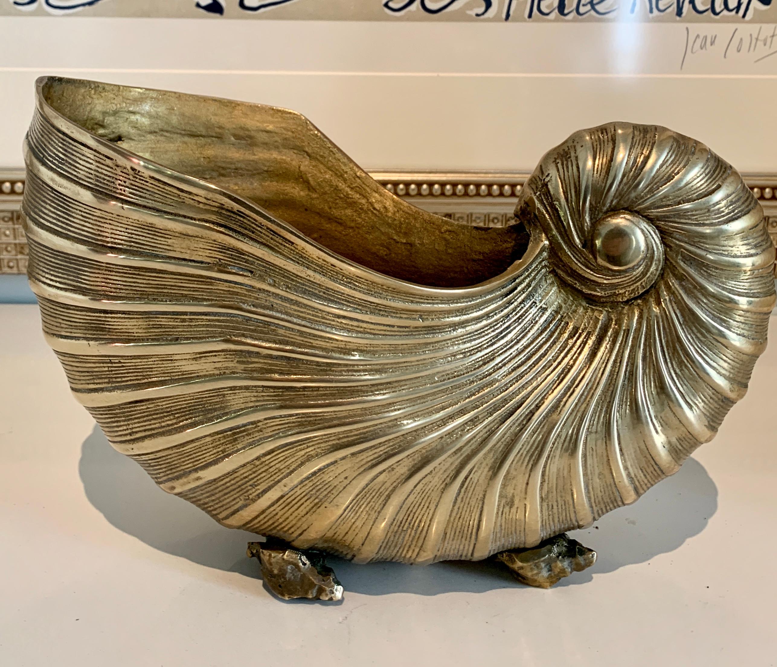 Solid brass sea shell nautilus planter jardiniere or cachepot - a stunning piece well suited as a centerpiece. The size also makes it a good piece to hold mail or as a catch all - also great as a stand alone piece.
