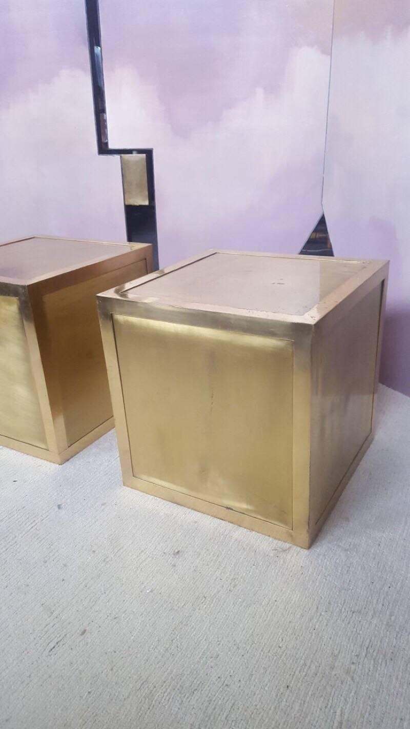 Very linear and elegant brass nightstands or side tables.