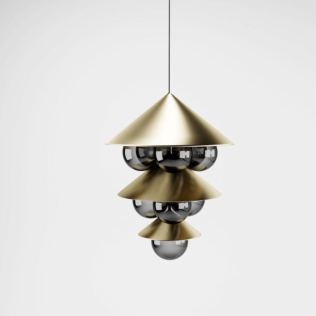 Brass Nonla pendant lamp II by Kasadamo
Dimensions: D 37.5 x H 62.5 cm
Materials: brass, aluminium, glass
Also available: other size, color, and glass colors available.

All our lamps can be wired according to each country. If sold to the USA