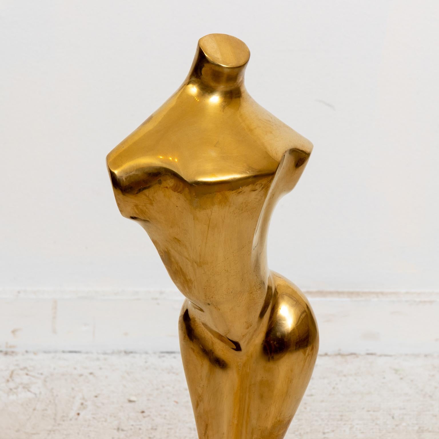 Hollywood Regency style brass nude sculpture on wood base. Good overall condition. Please note of wear consistent with age.