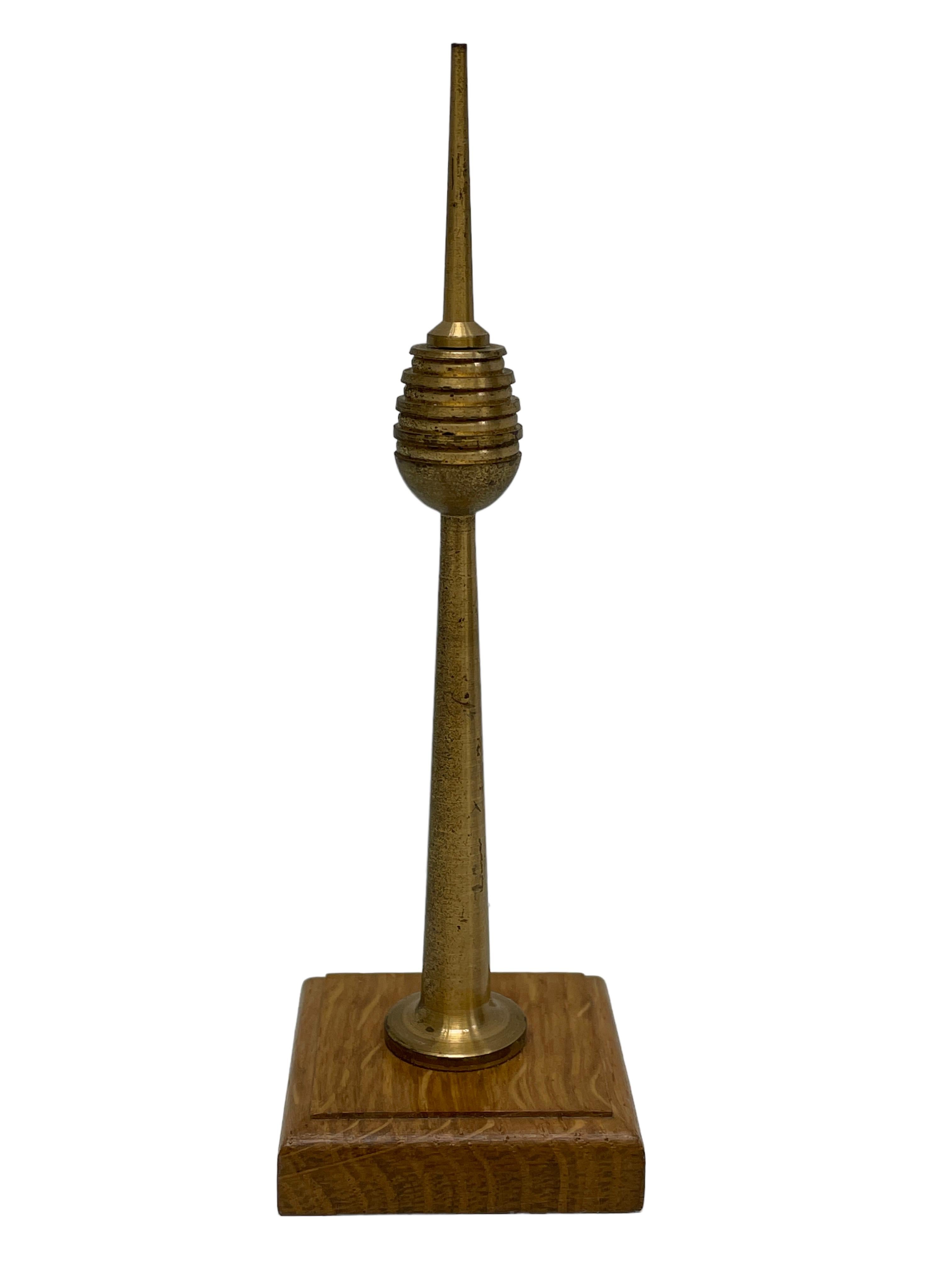 Scaled model of the Nuremberg television tower. Hand-spun in brass with a nice wooden base. A nice architectural sculpture for every living or man’s room.