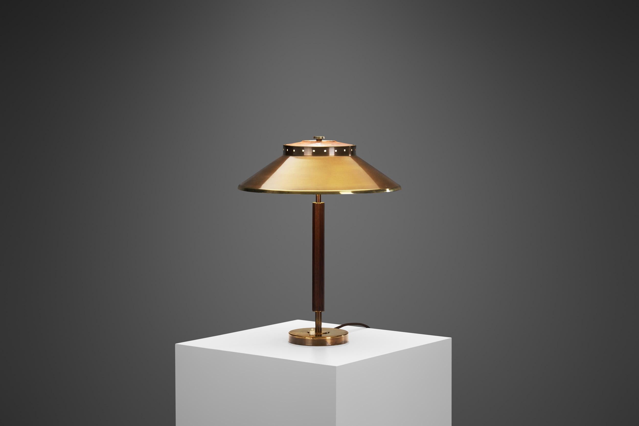 Characterized by clean lines, quality woods, soft edges and intuitive functionality, the Swedish Modern lighting models of Boréns Borås are eternally timeless and timely. This specific table lamp model is a delightfully distinctive piece, with