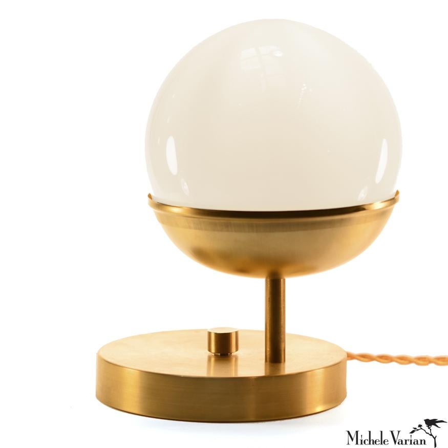A modern metal table lamp to accent your living room, bedroom or work space. This contemporary lighting pendant also works well in a commercial setting restaurant, retail, or office space.
Designed by Michele Varian
Unfinished brass and glass (clear