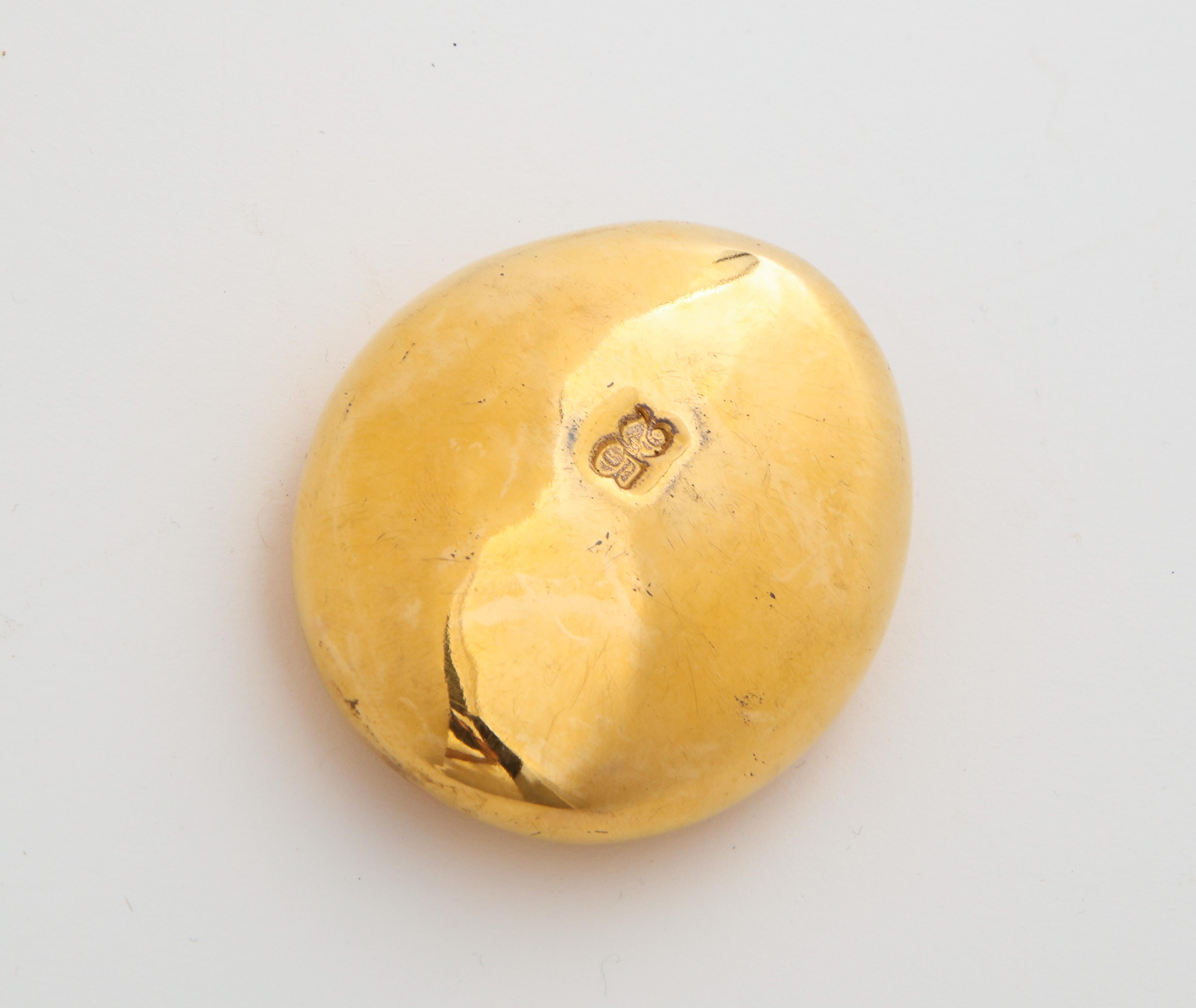 Brass oval paperweight with 