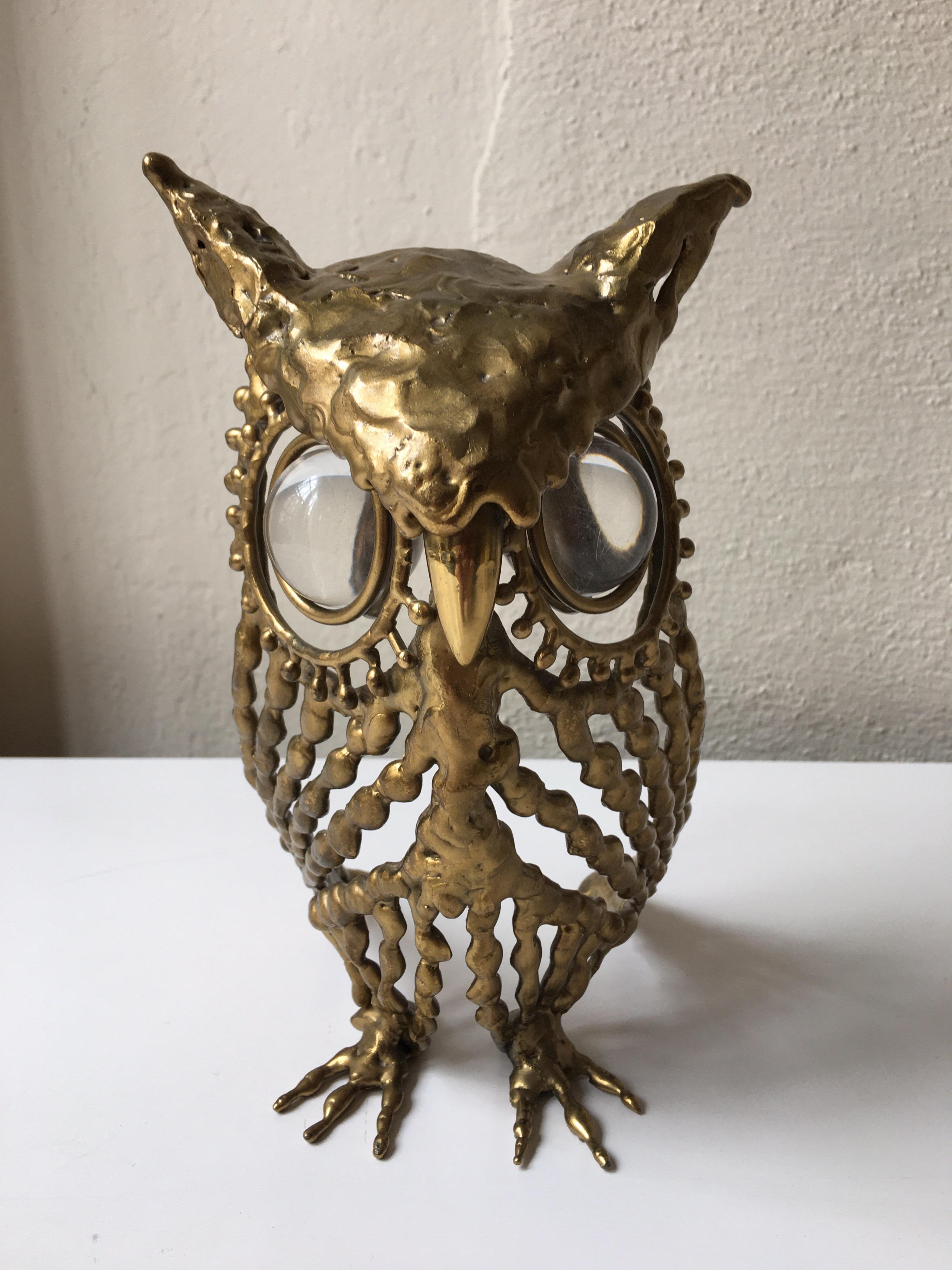 Nicely done brass owl with glass eyes, signed inside bottom wing.